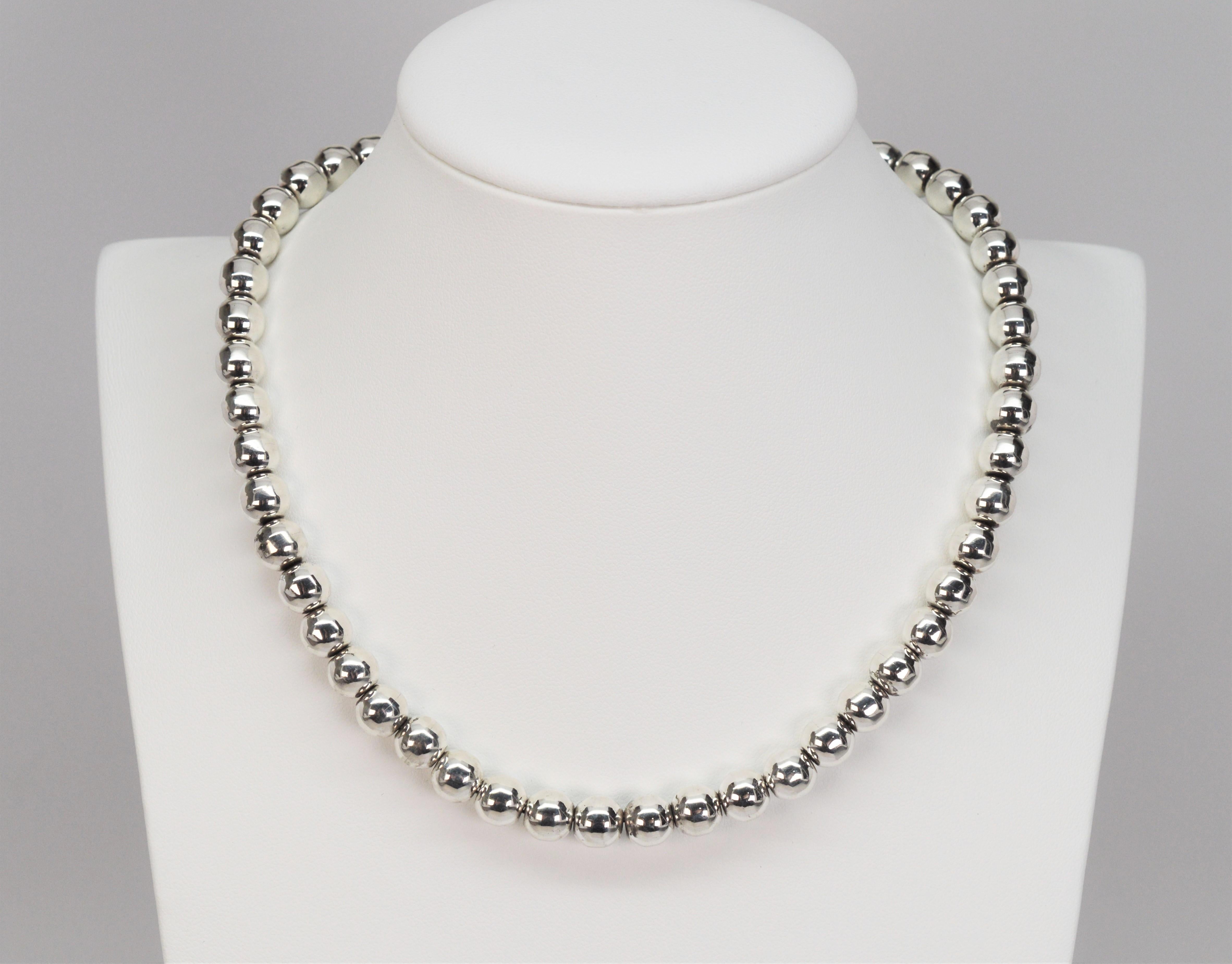 Add this classic silver beaded strand as a staple piece to brighten up your jewelry wardrobe. This versatile 16 inch necklace, great for casual wear or dress, is made fifty 7.5 mm polished .925 sterling silver beads and finished with a locking box