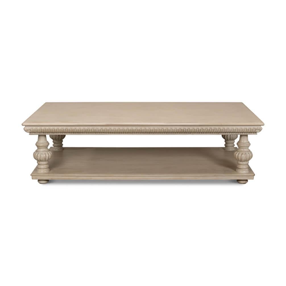 It features a spacious top, perfect for your coffee time essentials, and an open lower shelf that offers extra room for your books and decorative items.
The elegant turned legs and carved details give this table a timeless appeal that complements