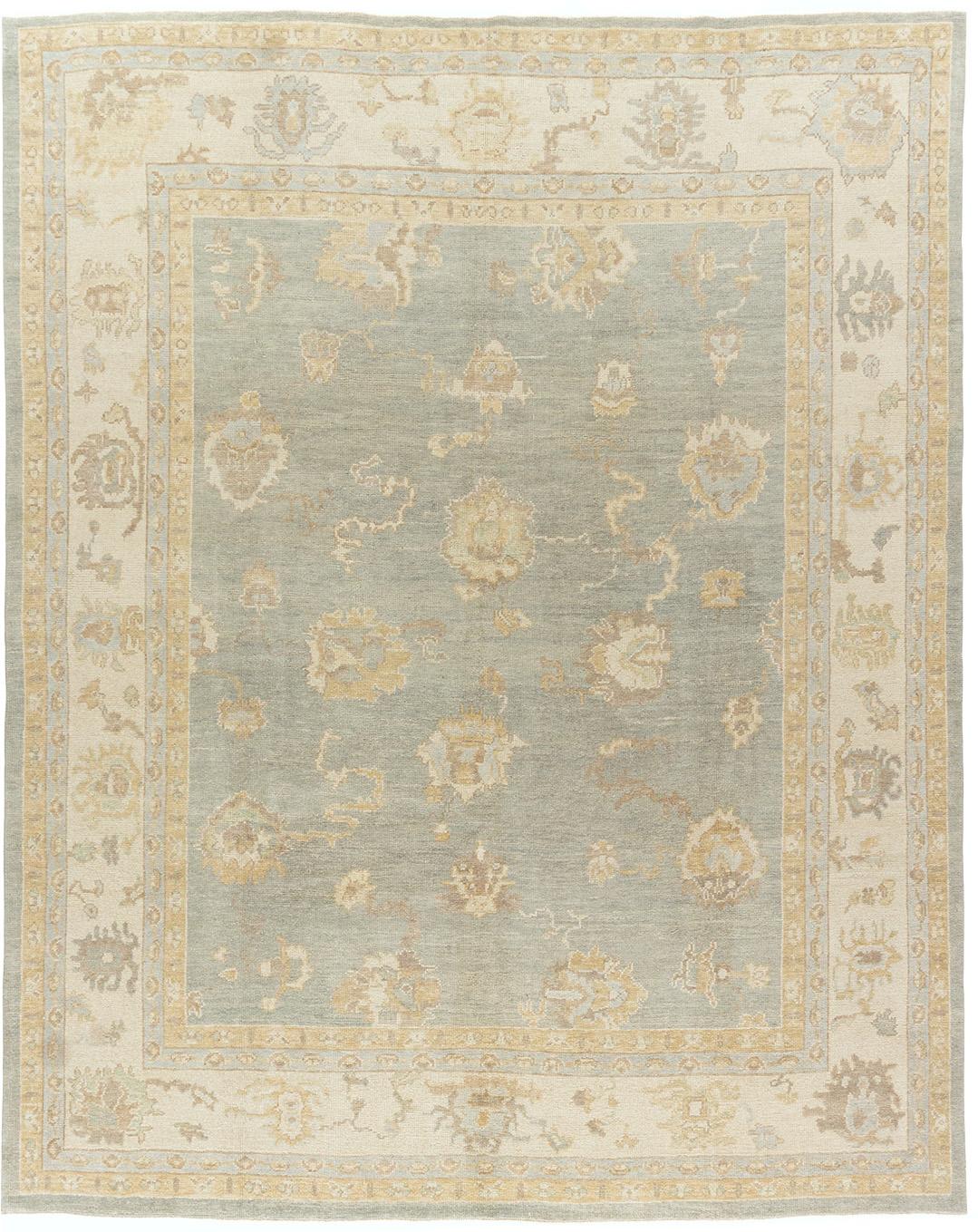 Classic Style Oushak hand knotted rug, 9' x 11'. A recreation of a Classic Oushak rug using the finest of material and handwoven in India by true craftsmen. Colors: blues/grays/ivory.