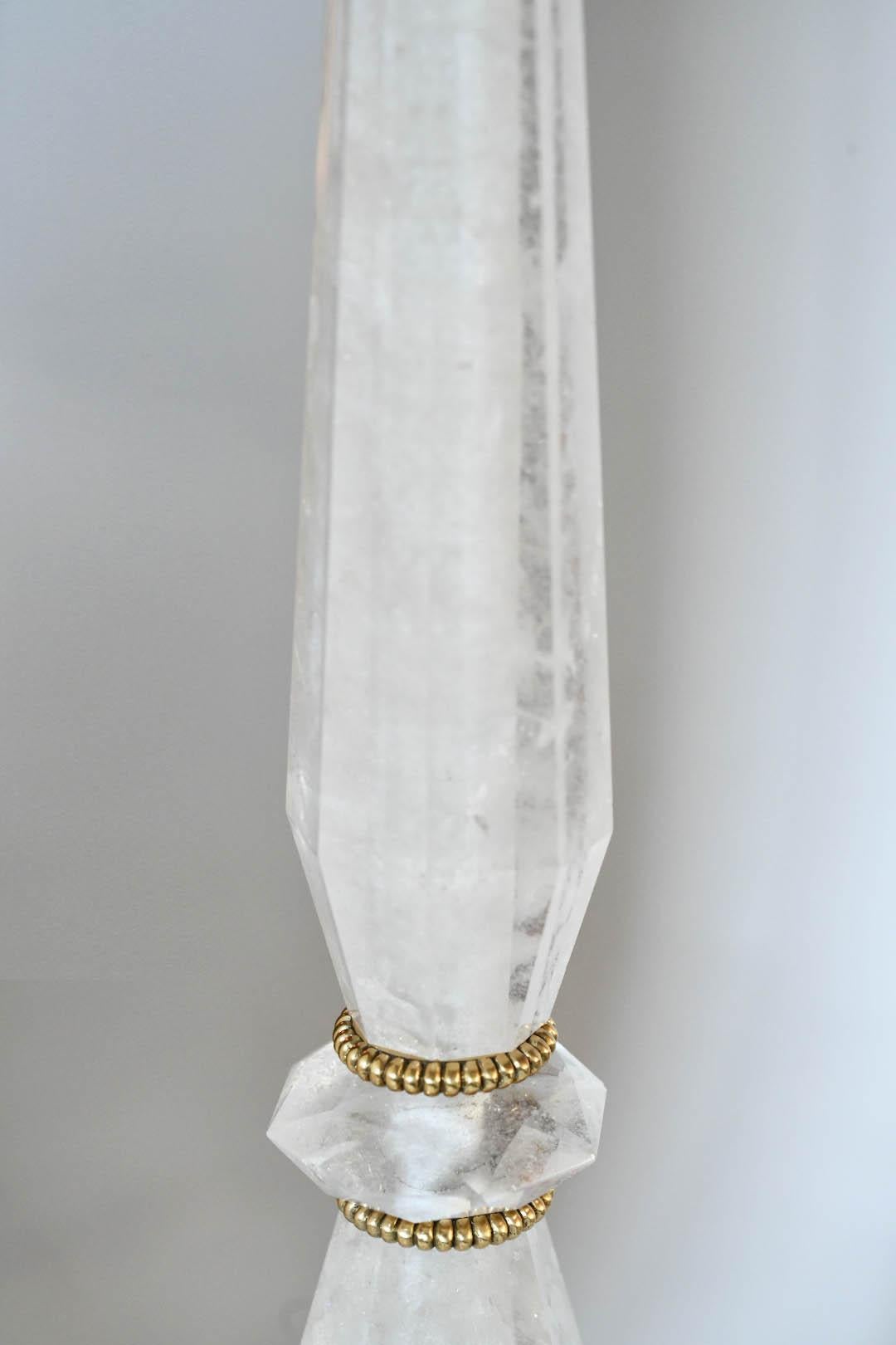 A pair of Classic style rock crystal lamps with fine cast brass bases. Created by Phoenix Gallery, NYC.
Measure: To the top of the rock crystal 18