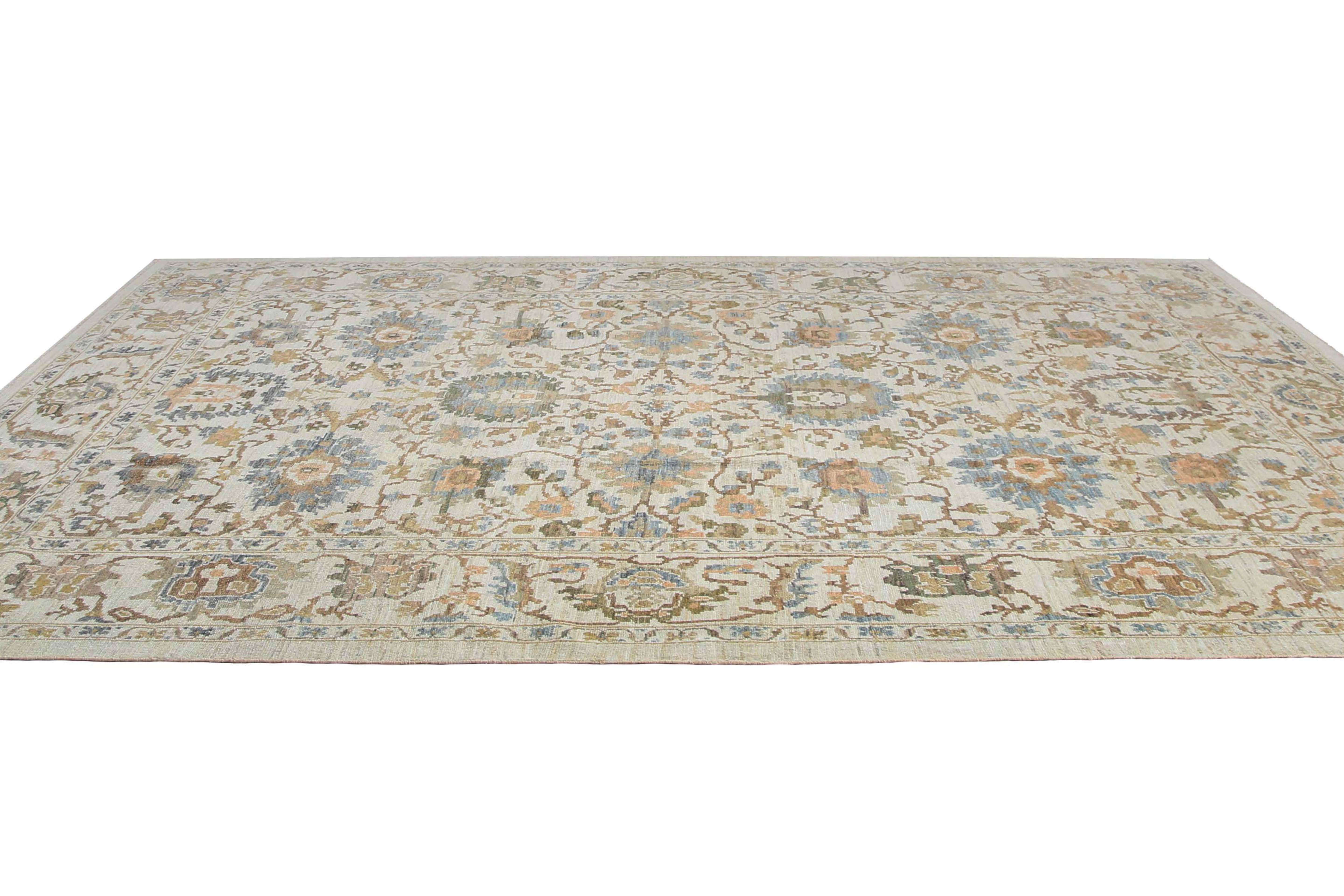 Introducing our stunning handmade Sultanabad rug from Turkey, now available in a 9'6'' x 12'6'' size. This classic traditional rug features a beautiful beige or off white background with intricate designs in shades of blue, green, and olive. The