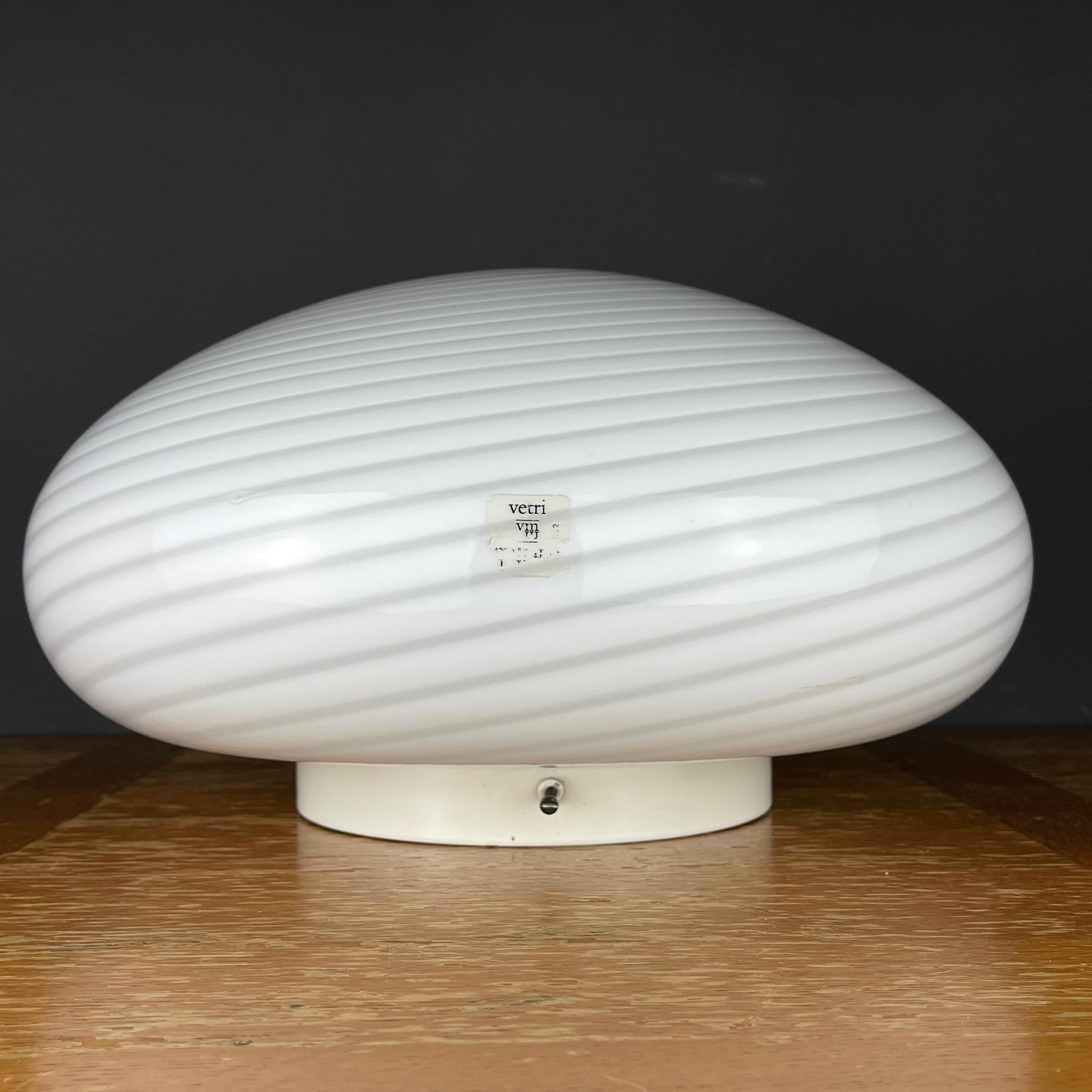 The beautiful white Murano glass ceiling or wall lamp Vetry Murano 022 by Venini was made in Italy in the 1970s. Can be used as a ceiling or wall lamp. The electrical system is fully functional and includes an E27 original ceramic bulb holder.