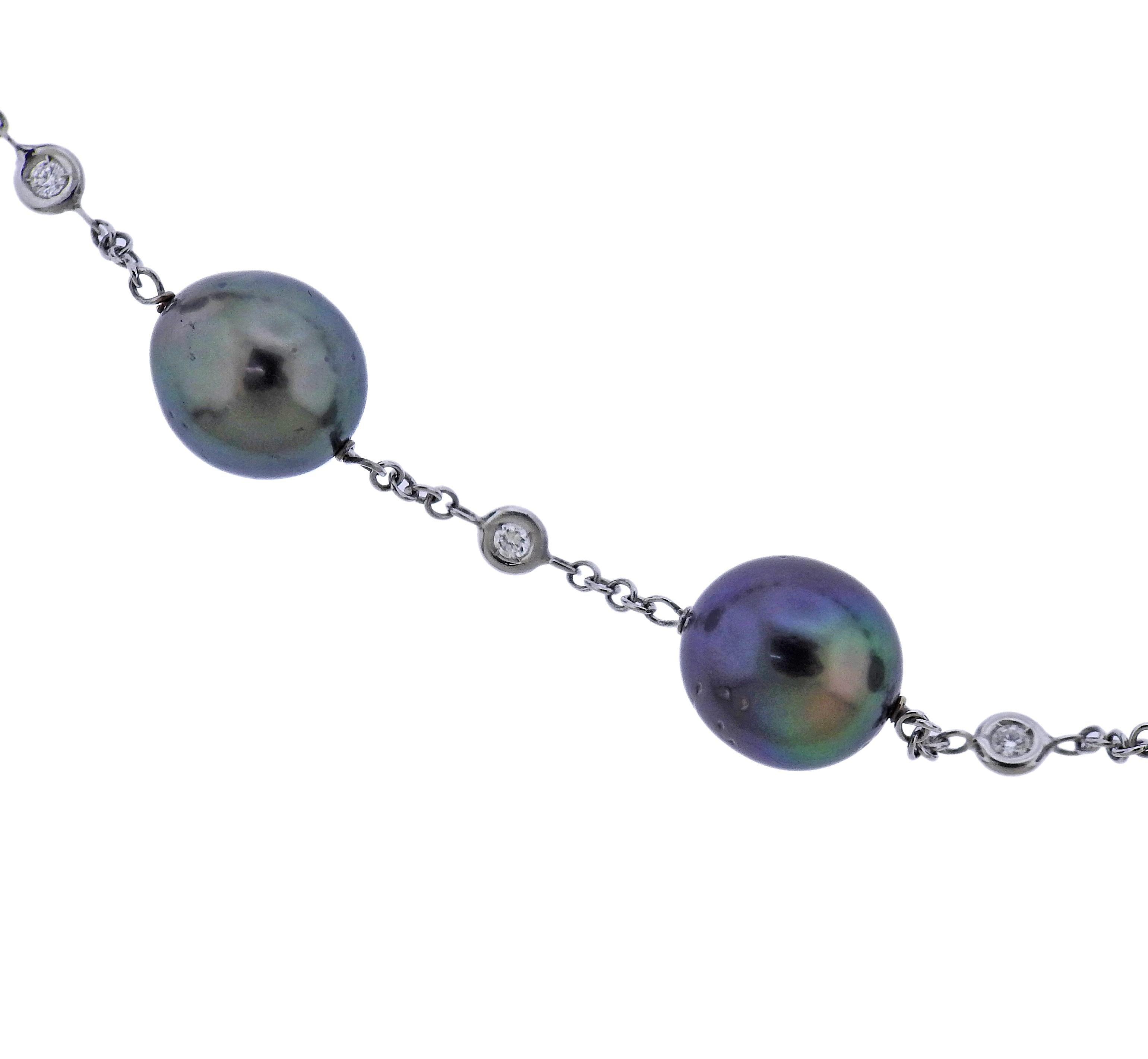 Classic 18k white gold station necklace, featuring South Sea Tahitian pearls, measuring from approx. 10 x 11mm to 12 x 13.5mm, surrounded with diamonds - total approx. 0.75ctw H/Si1 diamonds. Necklace is 20