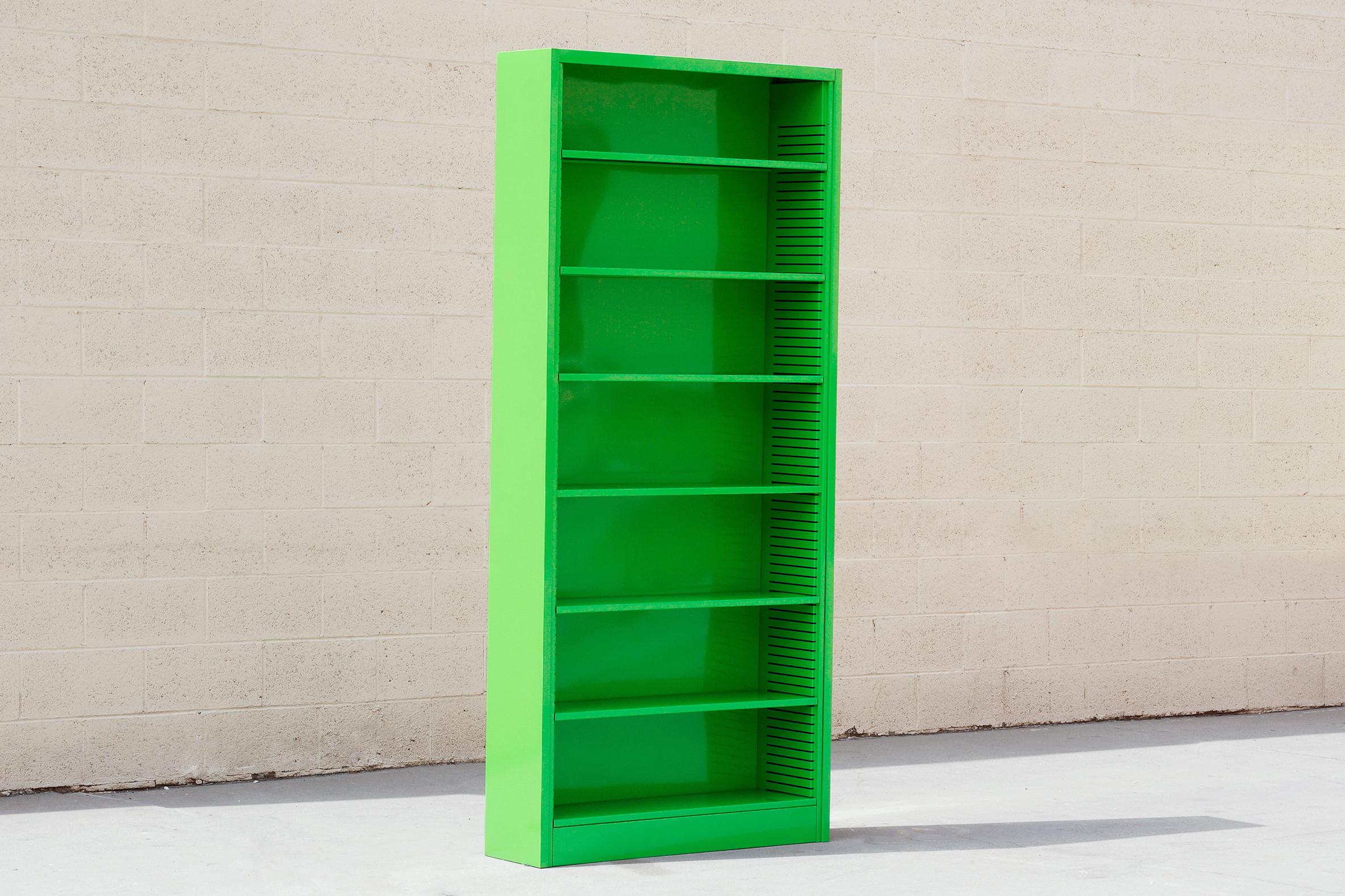 It's the 1970s tall tanker bookcase refinished in high gloss lime green. This minimal unit with six adjustable shelves is perfect for storage and display.

This piece is custom refinished to order. Please allow 3-4 weeks for production. 
Custom
