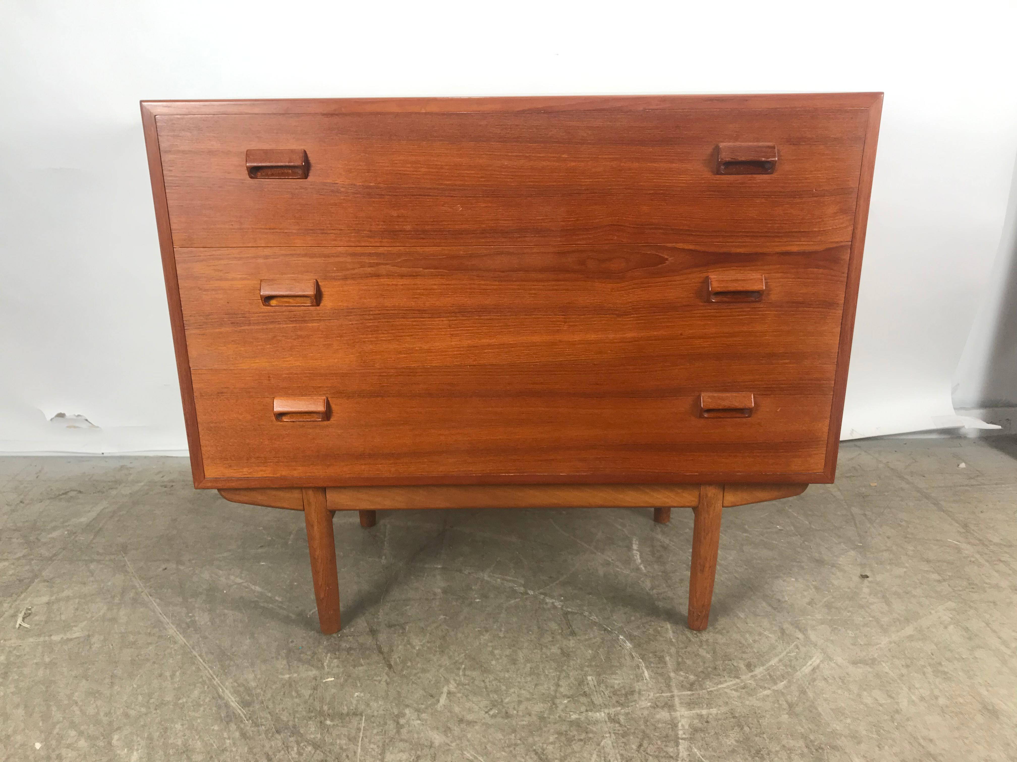Classic teak dresser desk or vanity designed by Børge Mogensen, Made in Denmark. Featuring two generous size drawers, top drawer revealing desk (drop down drawer front) with mail slots and small drawer, cubbies and surprise pull out mirror. Truly