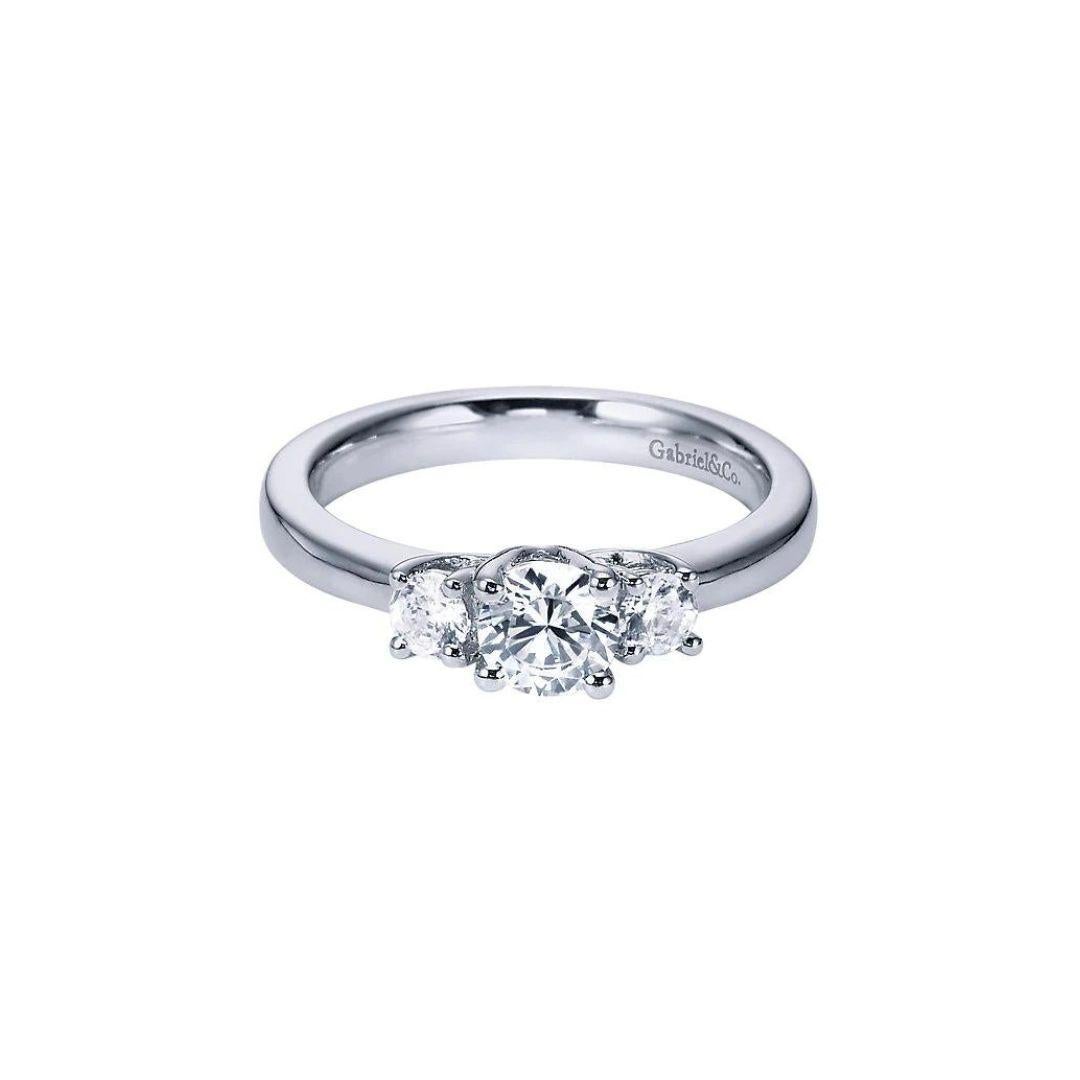 Classic Three Stone 14k White Gold Diamond Engagement Ring by Gabriel Co. Timeless traditional design and exceptional workmanship with beautiful natural white round brilliant cut diamonds.Total carat weight of diamonds is 0.50 ctw, H color, SI