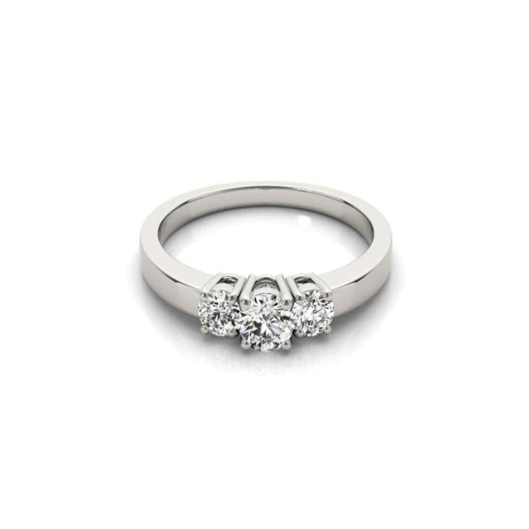 Classic Three Stone 14k White Gold Diamond Engagement Ring by Gabriel Co. Timeless traditional design and exceptional workmanship with beautiful natural white round brilliant cut diamonds.Total carat weight of diamonds is 0.90 ctw, H color, SI