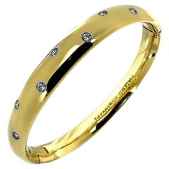 Classic Tiffany & Co. 18K Gold and Platinum Etoile Bangle Bracelet with Diamonds