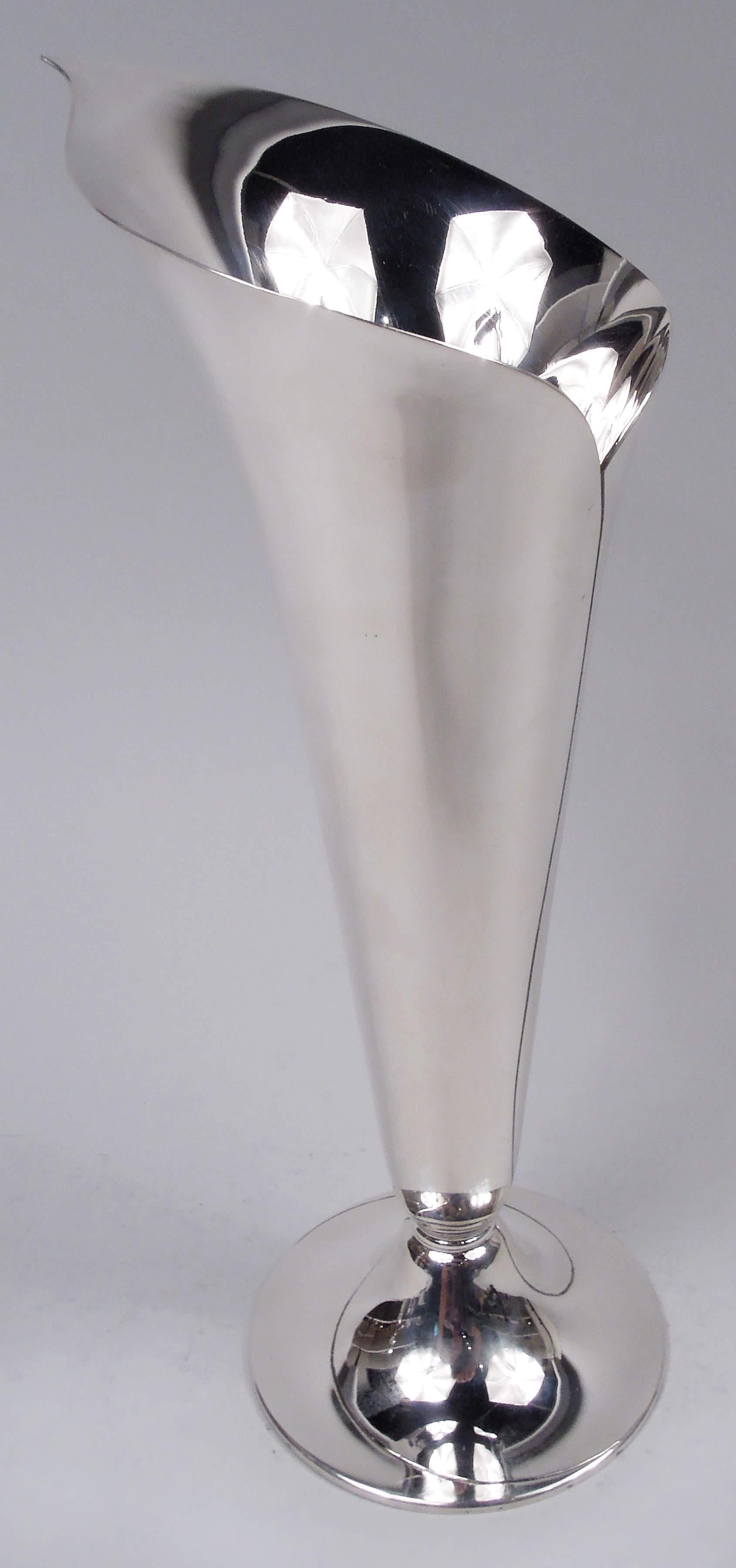 Classic Midcentury Modern sterling silver vase. Made by Tiffany & Co. in New York. In form of abstract calla lily with asymmetrical mouth and irregular seam. Raised round foot. Fully marked including maker’s stamp, postwar pattern no. 23425, and