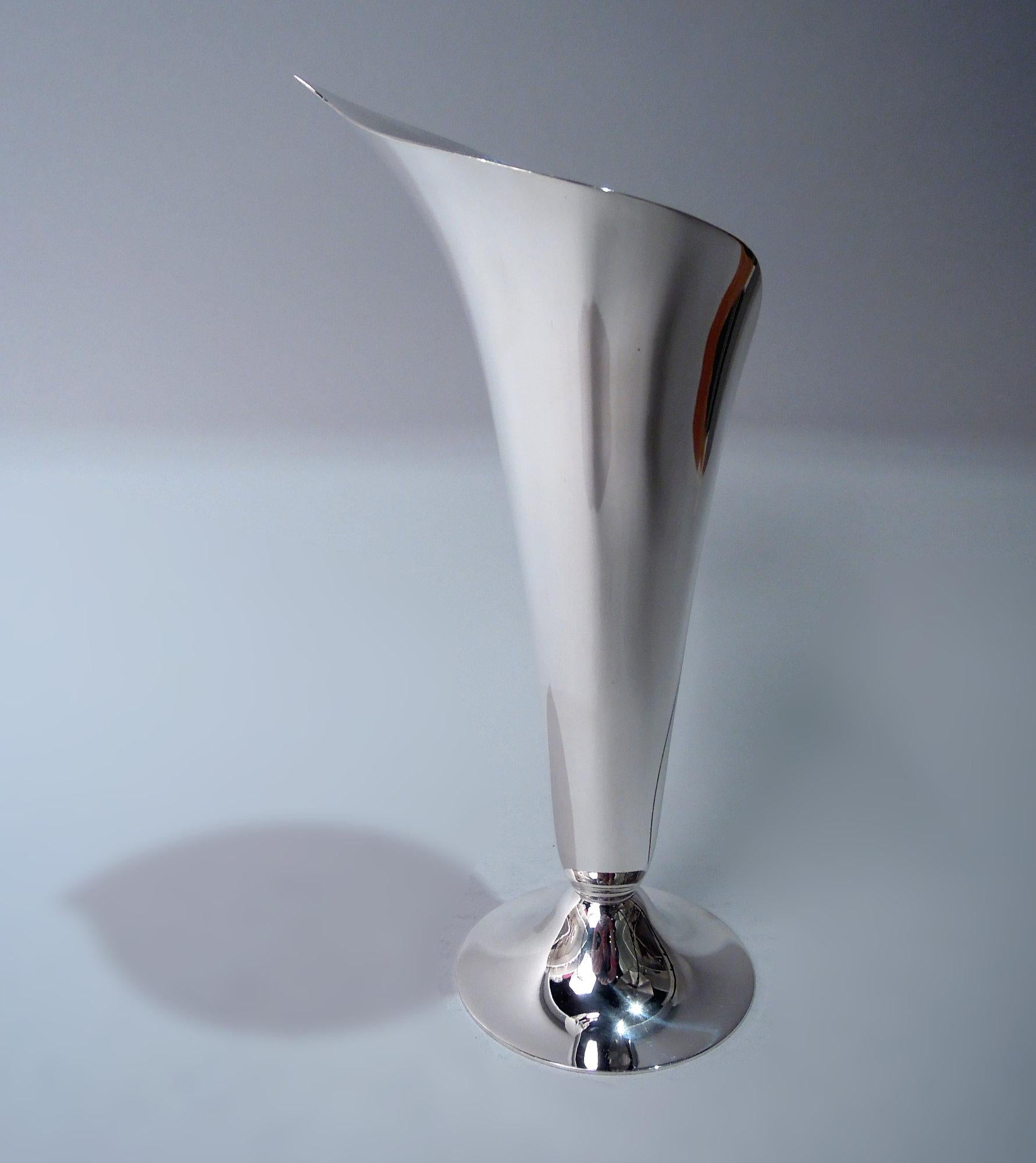 Classic Midcentury Modern sterling silver vase. Made by Tiffany & Co. in New York. In form of abstract calla lily with asymmetrical mouth and irregular seam. Raised round foot. Fully marked including maker’s stamp, pattern no. 23509, and
