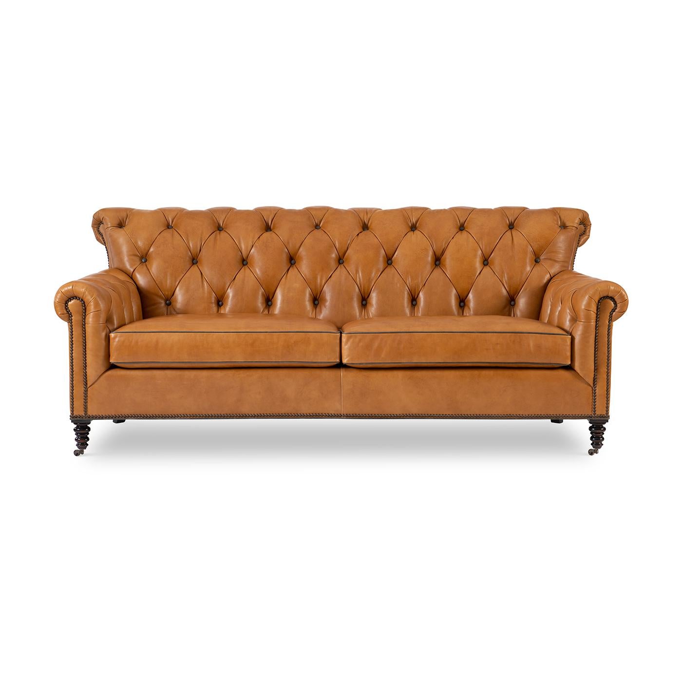 Classic Tufted 3 seater sofa, With a tufted and rolled backrest and arms, with a two-boxed seat cushion, wonderful detail nailheads and turned and tapered legs.

A wonderful classic design that works well with almost any decor.

Completely Made
