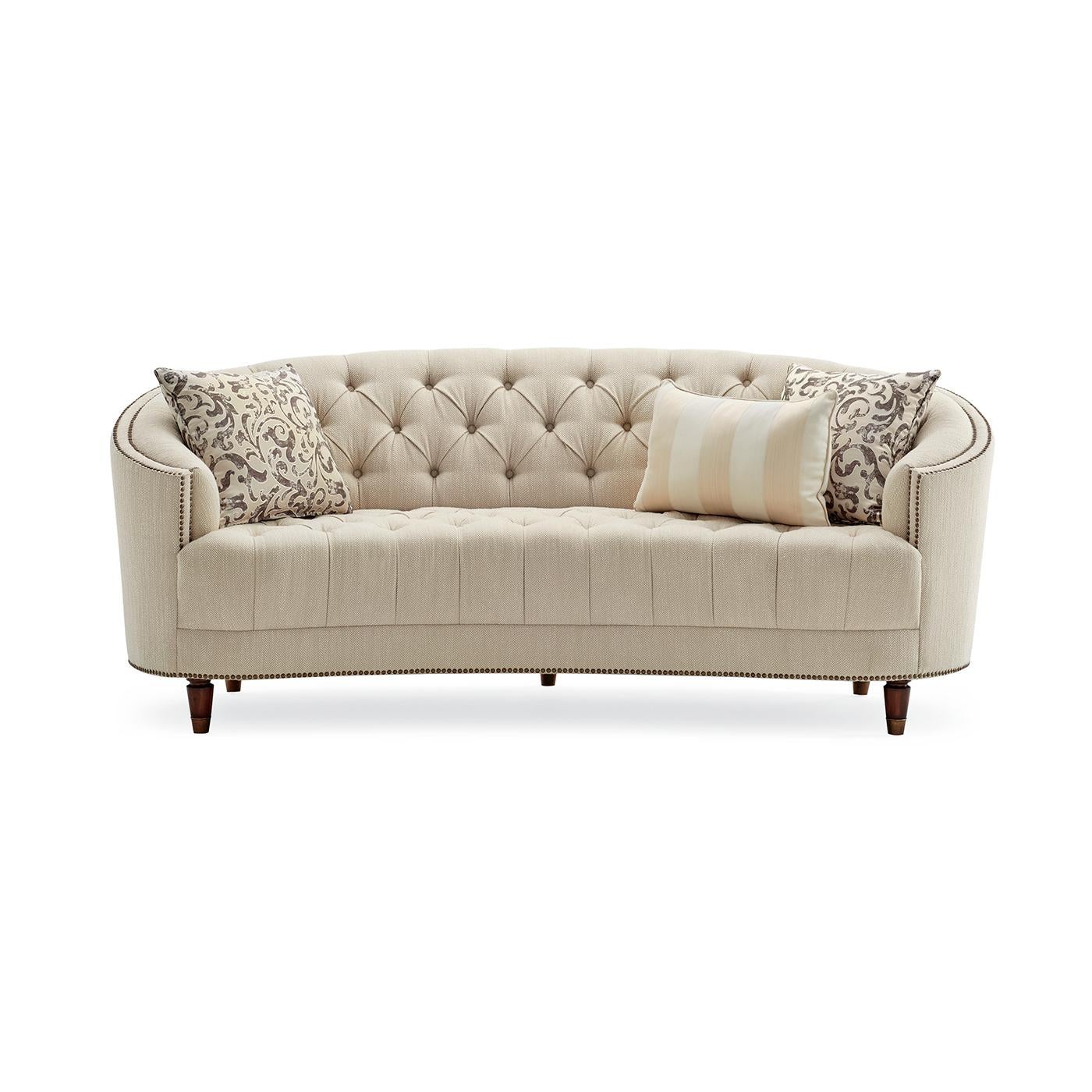 Classic tufted curved back bench seat sofa. Curvaceous and shapely, with traditional elements like button-tufting and decorative nailhead trim, this bench seat sofa also conveys a modern sensibility covered in a subtly textured herringbone fabric,