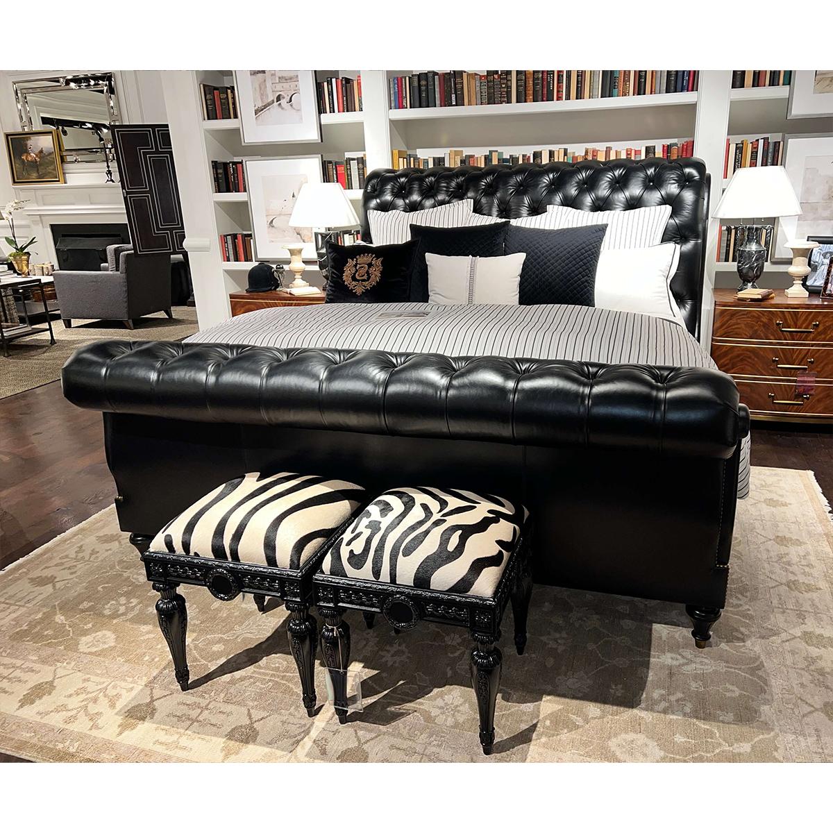 This stunning bed is upholstered in black leather, offering a smooth, sophisticated feel. The elegant tufted design on the headboard and footboard adds a classic touch, while the French Natural finish nailhead trim provides a hint of vintage