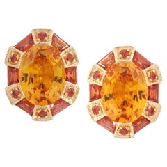 Klassische Twist 75 Ohrringe mit ovalem orangefarbenem und gelbem Saphir aus 18K Gelbgold