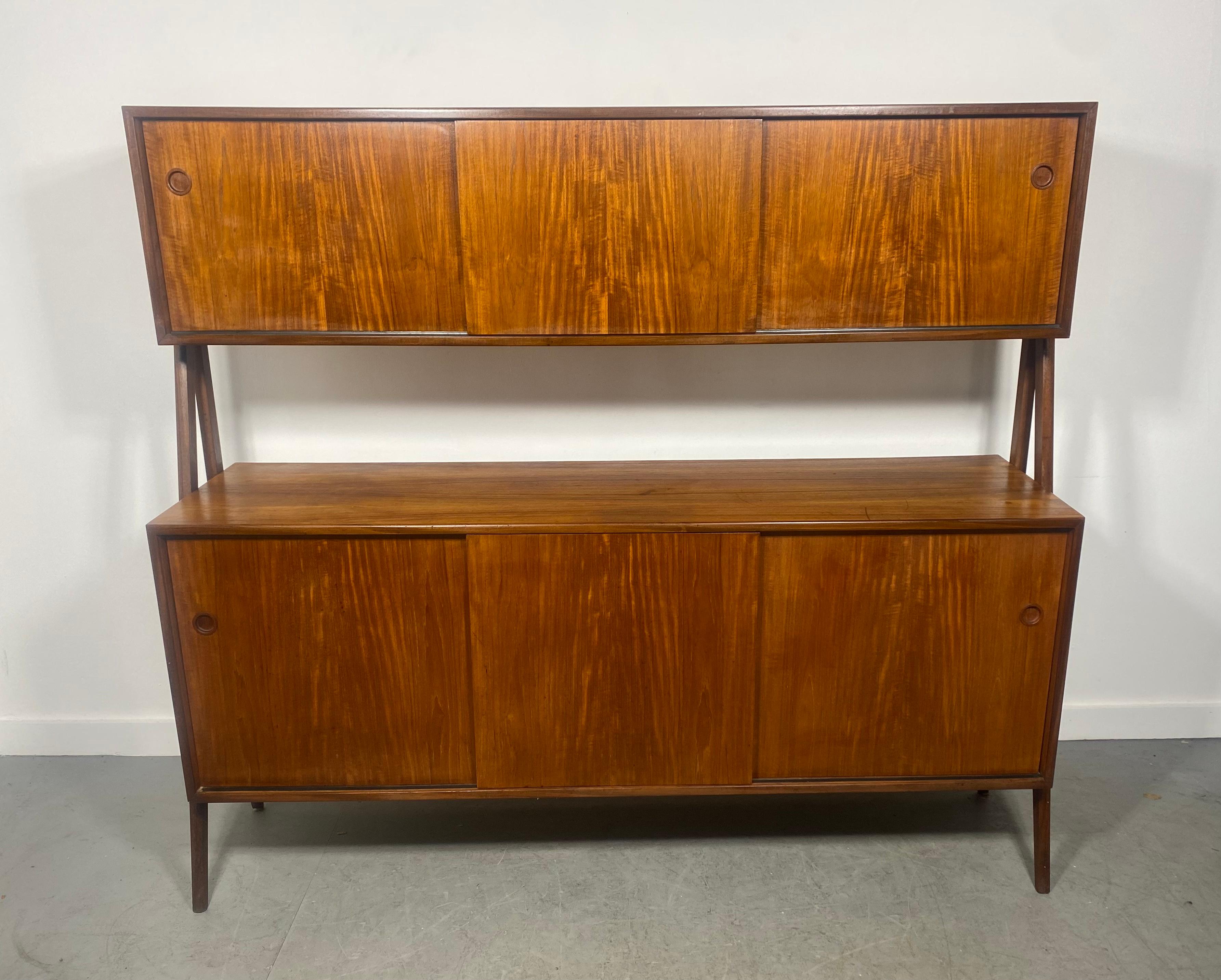 Two Tier Mid-Century Modern Sideboard Credenza Hutch In Teak and Oak by Randers Mobelfabrik in rich teak with solid oak supports. These two wood types create such a wonderful contrast to each other. The case offers a variety of storage options on