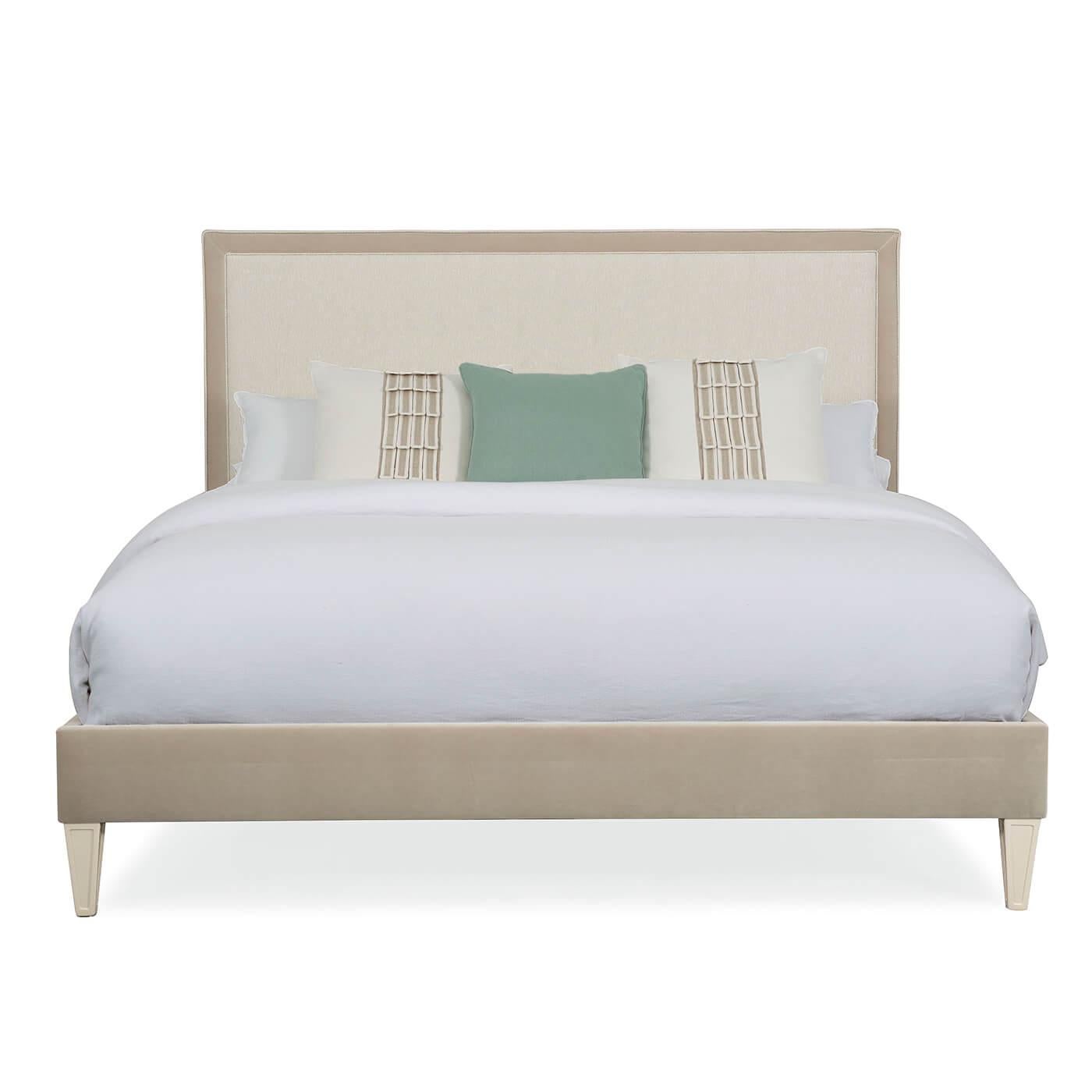 A classic upholstered king bed with timeless style and design details. This luxurious bed has a plush, performance fabric-covered headboard with a coordinating upholstered footboard and side rails. This bed rests on tapered legs in Pearl Drop