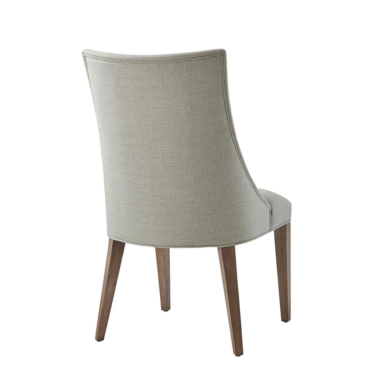 With an upholstered back, arm, and tight seat cushion, in the Draper performance fabric, with traditional square tapered legs in our light mangrove finish. 

Dimensions: 21