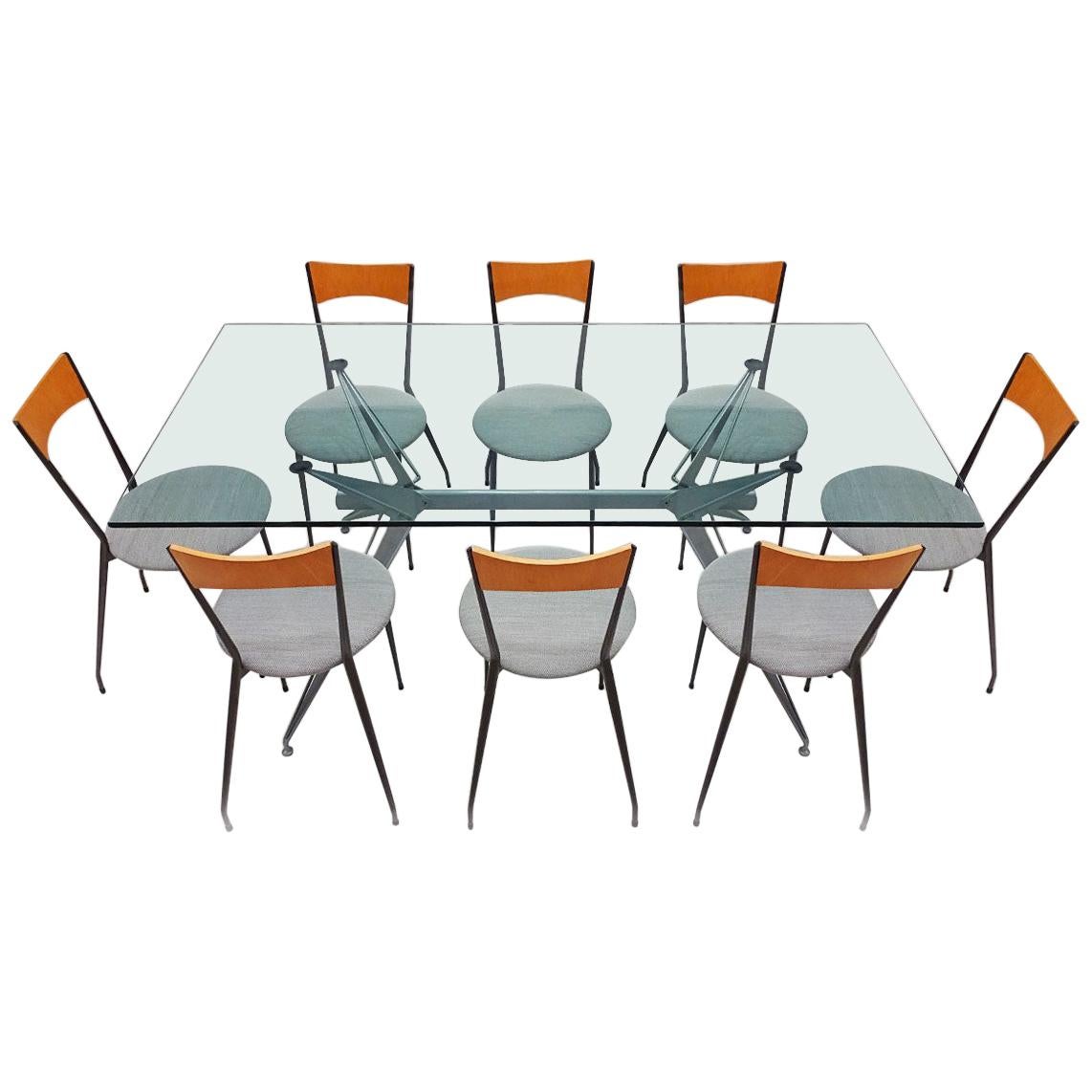 This is a Classic dining set that was sold in the Conran flagship store in London throughout the late 1980s and 1990s.

The set comprises a Fasem Italian metal and glass table with an angular design that is matched to a set of 8 metal, fabric and