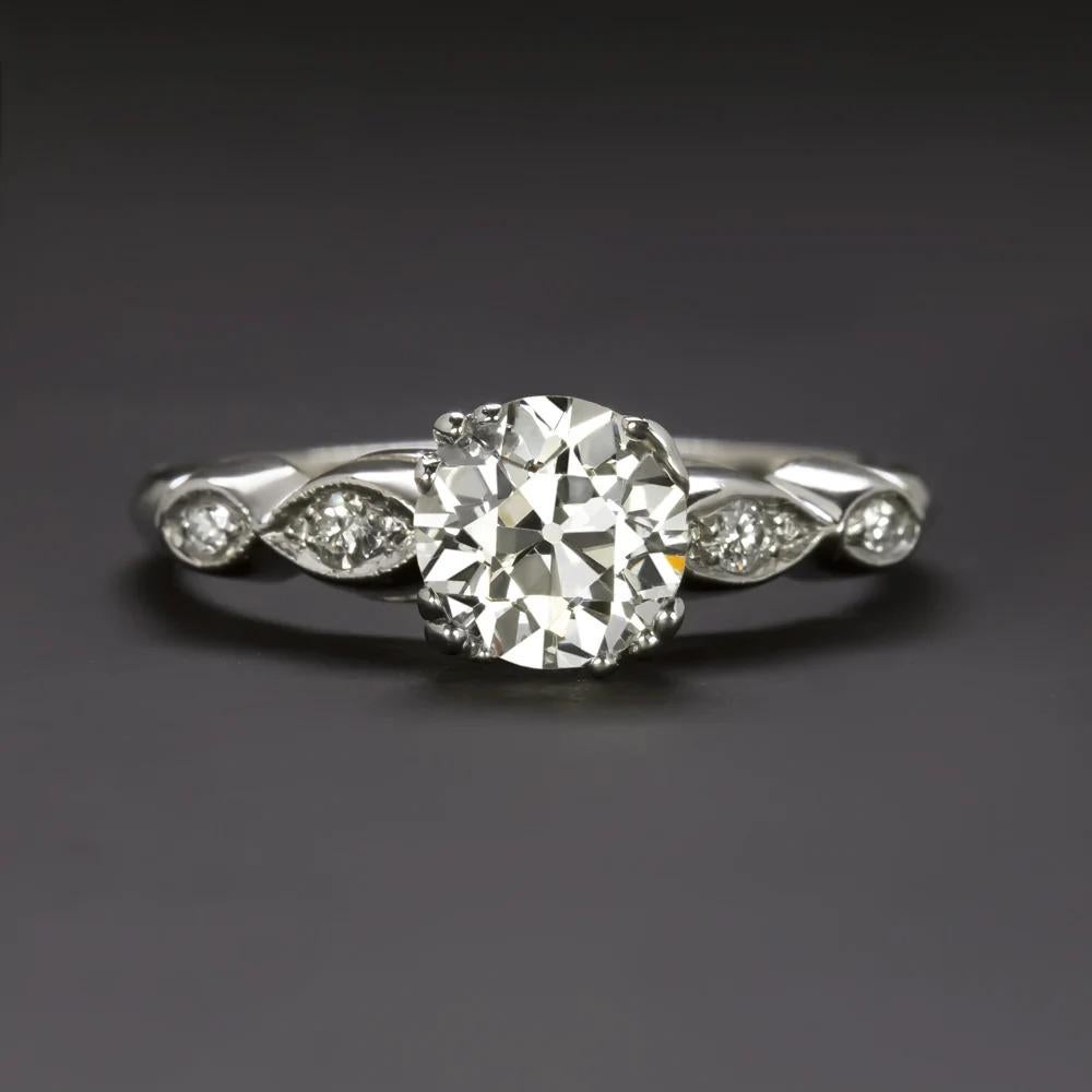 classic vintage engagement ring is certified and dazzling with brilliant sparkle and beautifully crafted with simple yet elegant details. The impressive 1.20ct old European cut center diamond is vibrant, and bright white, a rarity in diamonds from