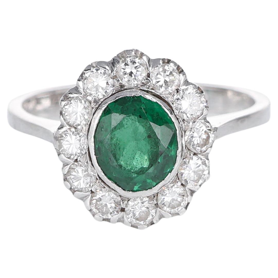 Classic Vintage Halo Ring Oval Emerald 0.45 carats and White Diamond White Gold For Sale