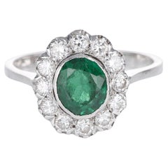 Classic Vintage Halo Ring Oval Emerald 0.45 carats and White Diamond White Gold