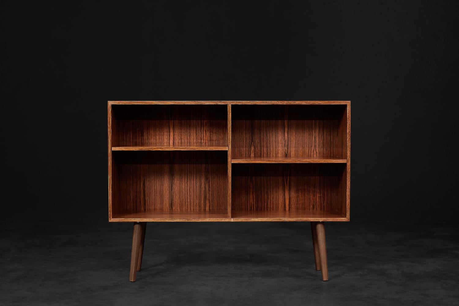 This classic modernist cabinet was made in Denmark during the 1960s. Made of high-quality, noble rosewood. Its structure is very strong, with expressive graining. The pieces of furniture made of this wood have a very decorative and luxurious look.