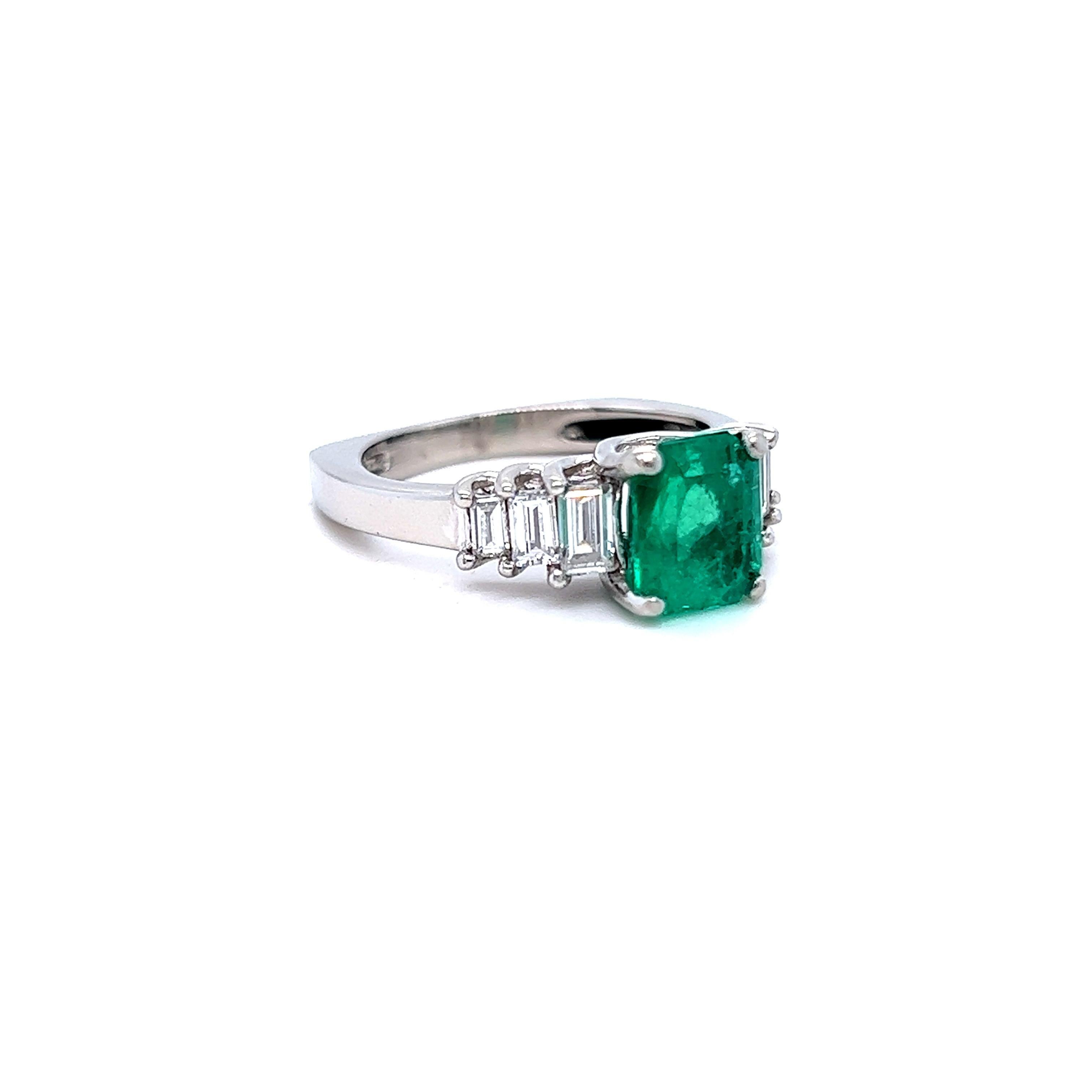 LOVE this Classic Vintage Natural Emerald Engagement Ring! Crafted in Platinum, the engagement ring features an Emerald Cut Natural Emerald, approximately 1.50ct in weight, of excellent quality. The deep, rich green color of this Emerald is just