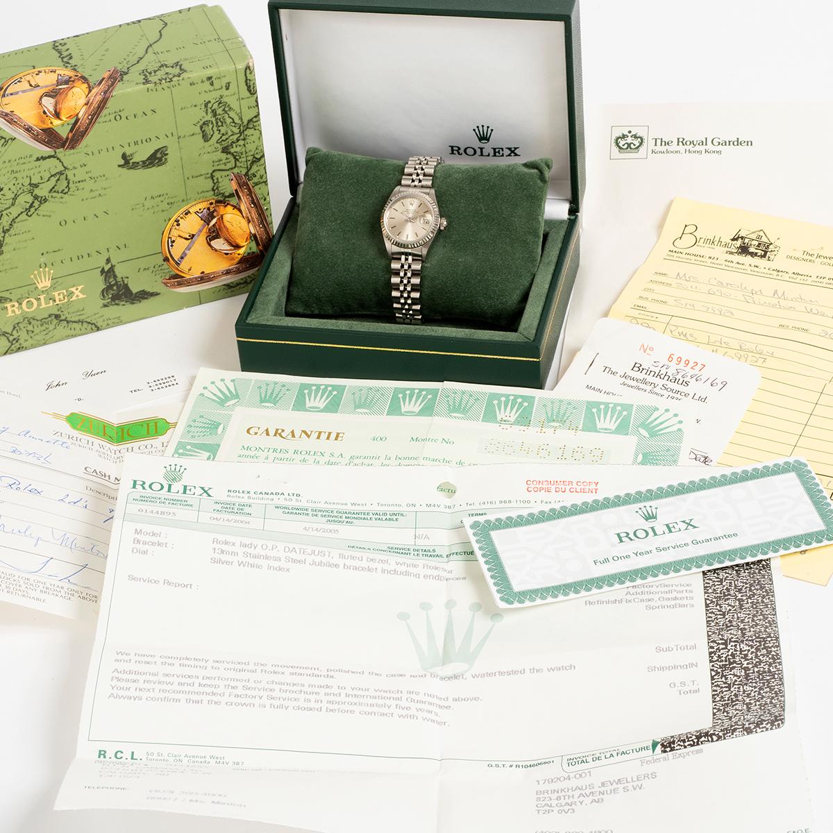 Our classic Rolex Lady Datejust reference 69174 features a 26mm stainless steel case with white gold fluted bezel and jubilee steel bracelet. Presented in excellent condition for its age, our ladies Datejust comes complete with inner and outer box,