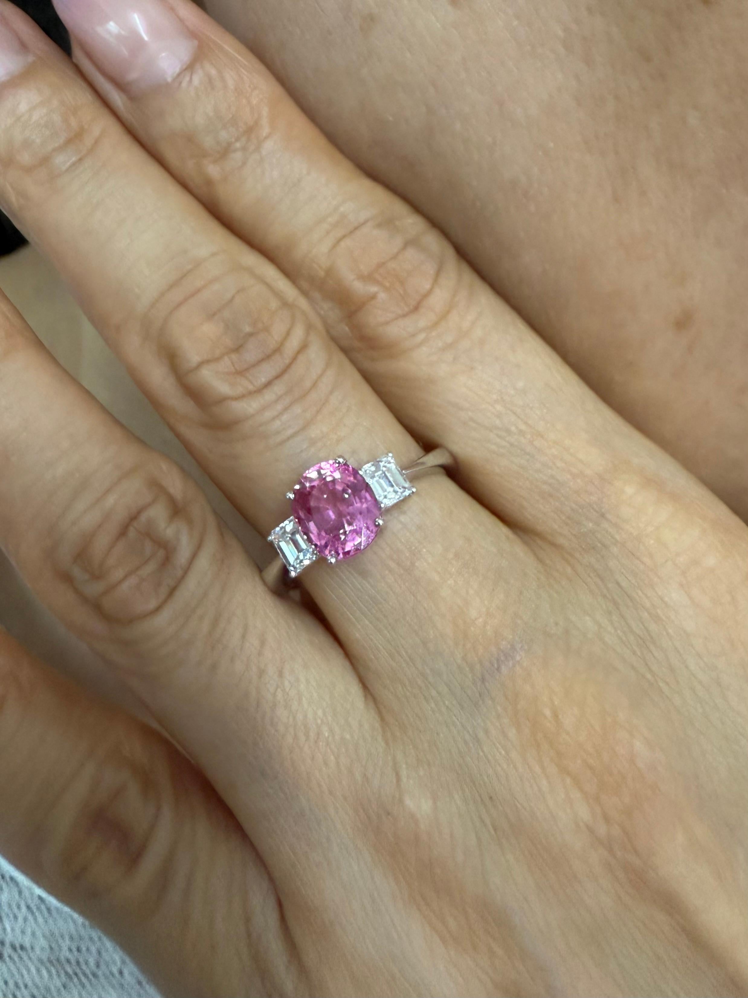 Please check out the HD video which accurately shows the color and clarity of the oval pink sapphire. The color of this vivid pink sapphire (2.20cts) is stunning! In words, we would describe the color of this sapphire as vivid pink. It GLOWS! We are