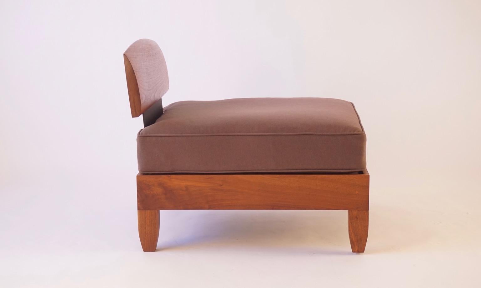 This club chair was designed soon after the classic daybed and has the same Scandinavian and African influences and construction techniques. This version is made from black walnut with blackened aluminium side supports and with a rubbed oil finish.