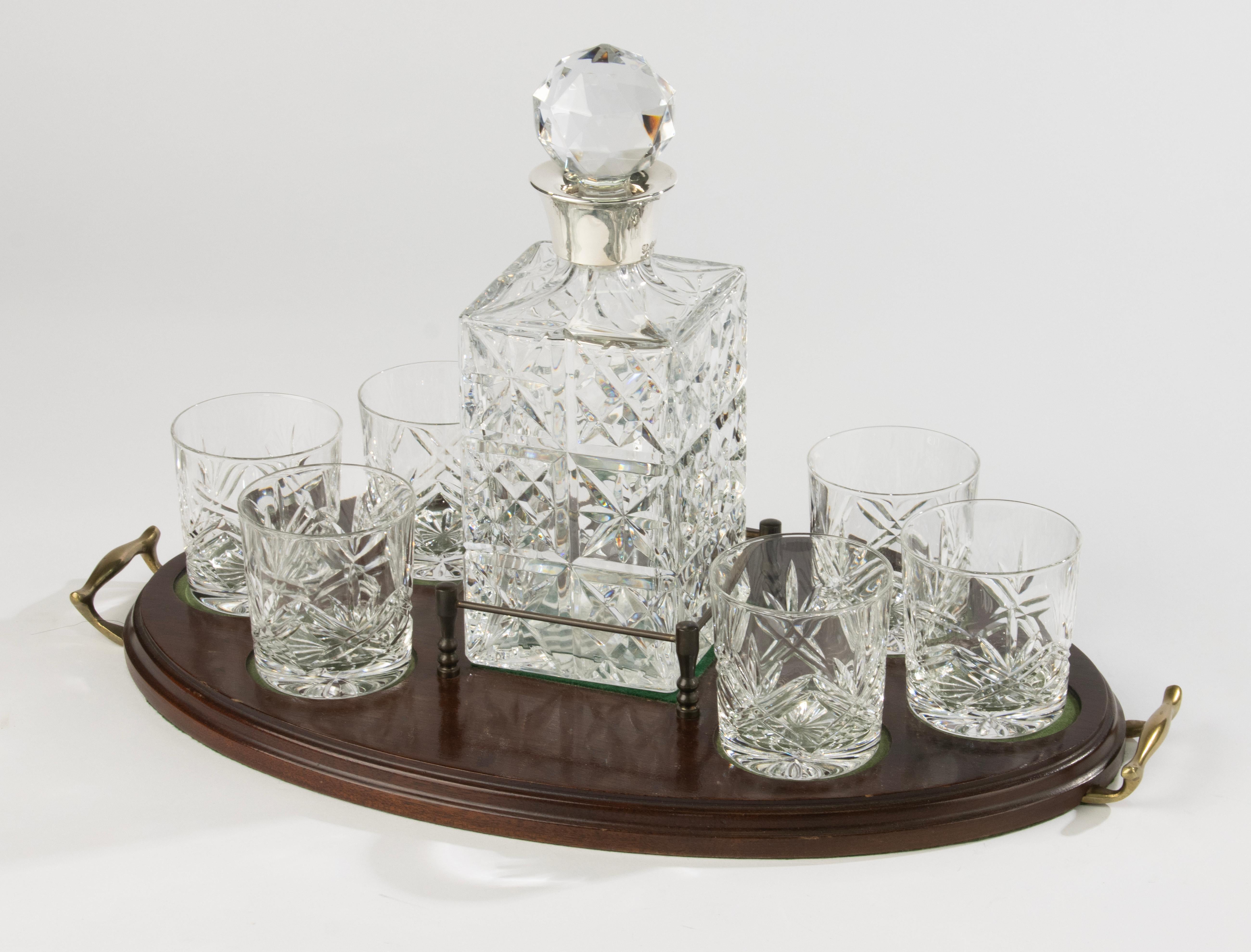 Elegant English sterling silver and cut crystal decanter set, hallmarked Sheffield 1972 by S. Smith & Son Ltd. The set consists of a square decanter with faceted stopper, six tumblers, and a fitted wooden tray with brass handles. The crystal is