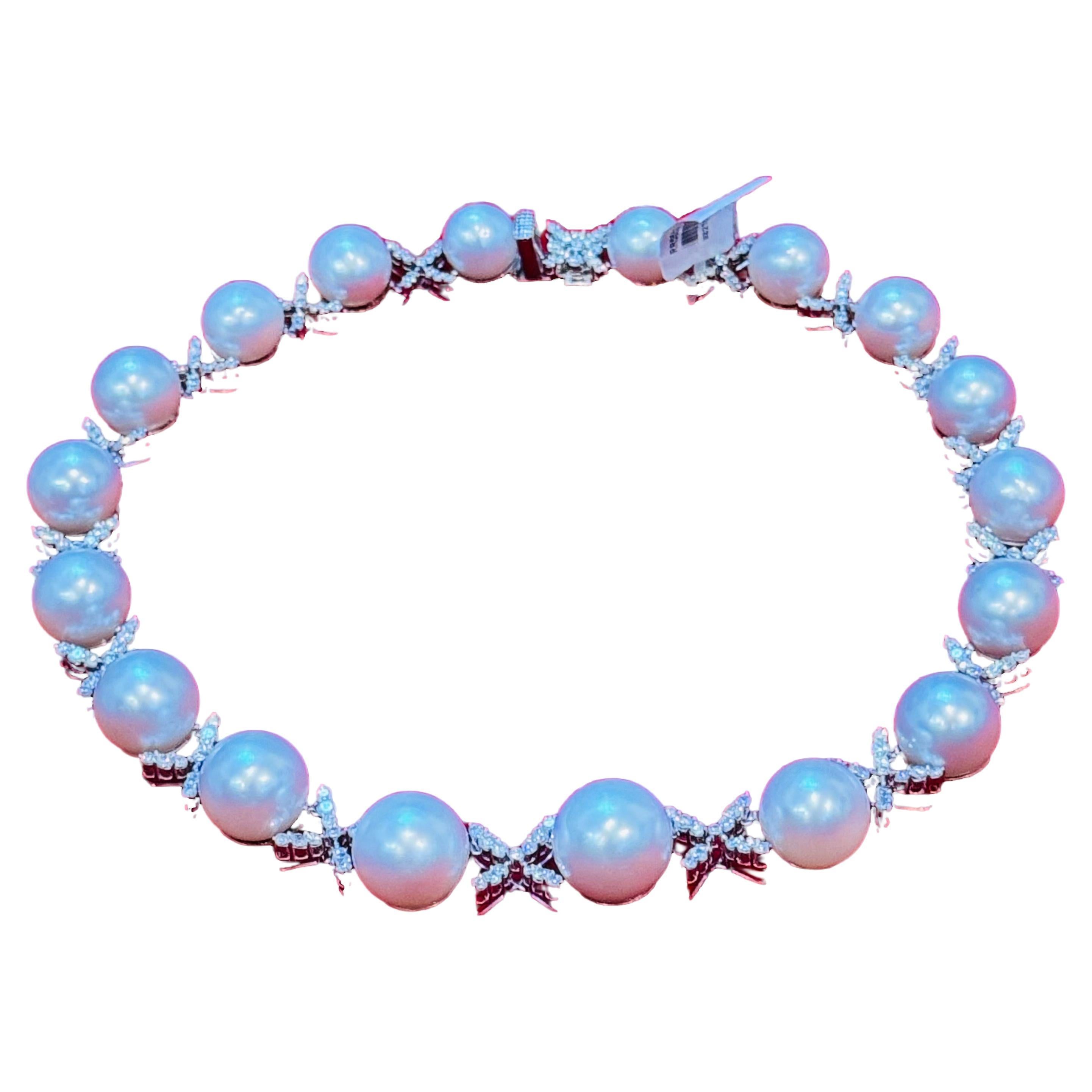 This Listing is for Necklace only
Emulating a wreath of delicate flowers, this South sea pearl necklace features the opulent White South Sea cultured pearl. Each pearl is alternating with a design of glimmering diamond and white gold cross . This