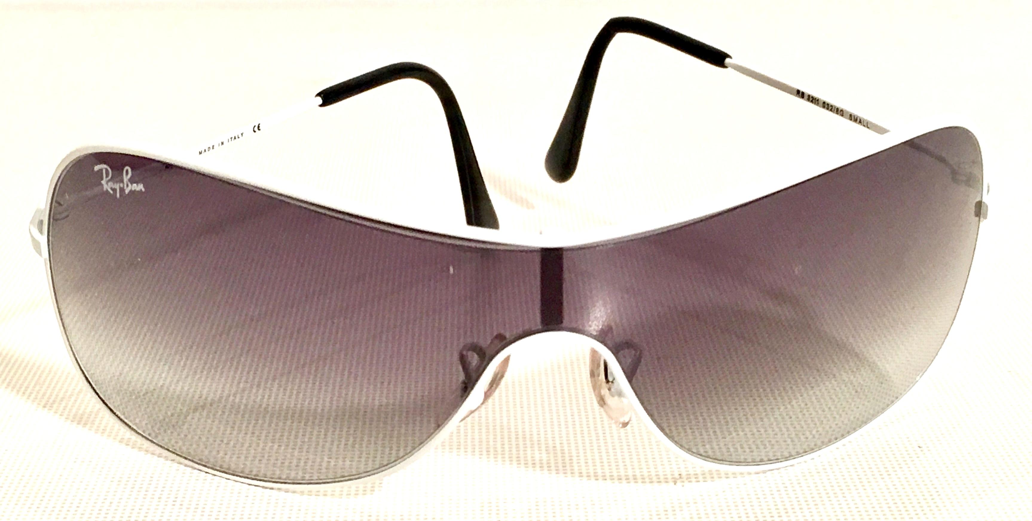 Ray-Ban classic white metal frame aviator sunglasses with grey shaded lenses. Made in Italy and marked 3211 small. Includes Ray-Ban soft red protective carrying case.