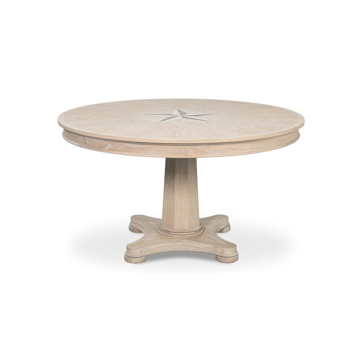 This stunning round oak table is a showcase of craftsmanship and elegance. Designed with a classical touch, the table features a beautiful nautical mariner starburst inlay at the center, creating a compelling focal point that draws the eye. The