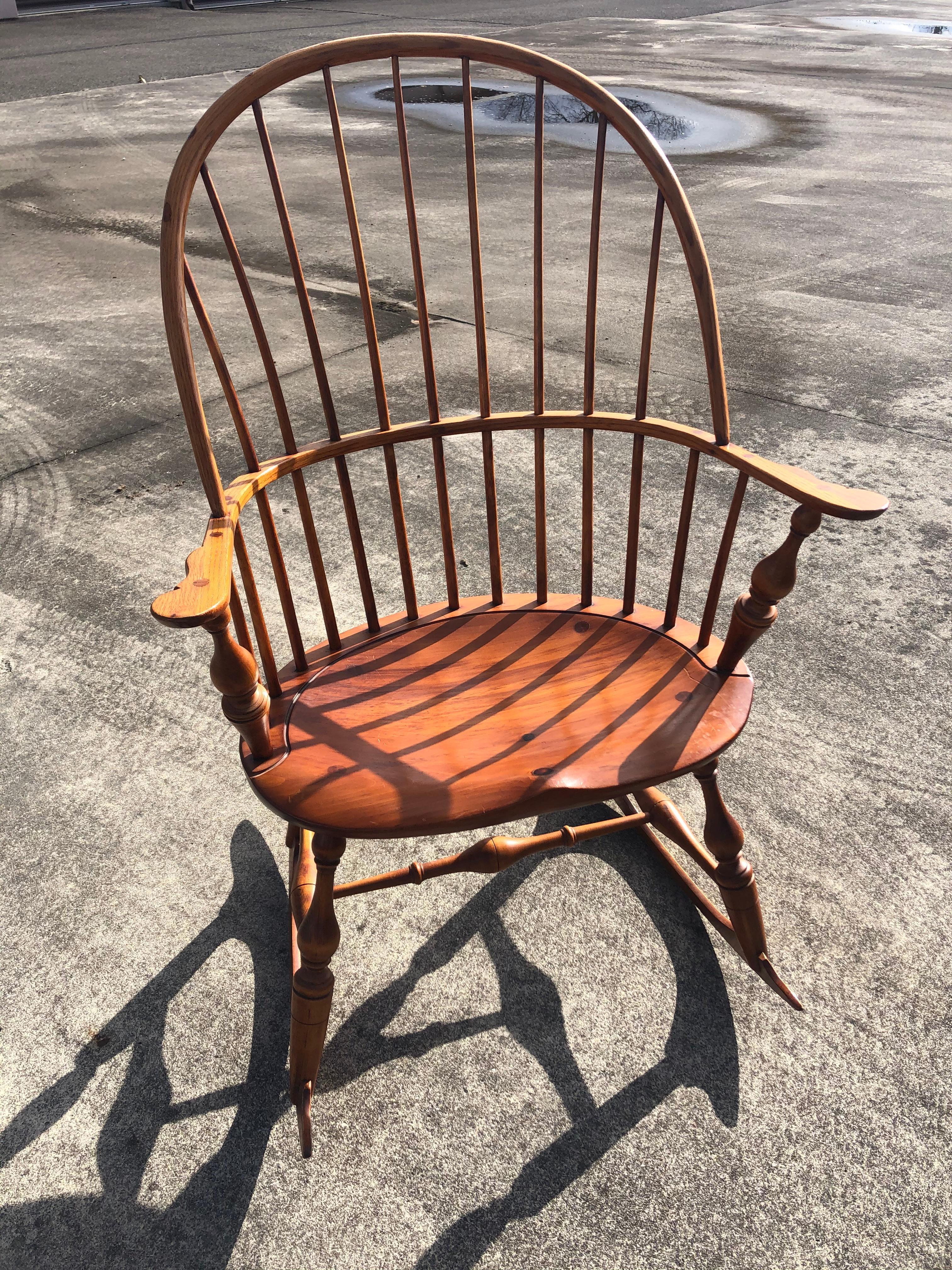 Beautifully made Windsor style rocking chair in what looks like maple, having modeled seat and fine spindles on a curved back. The legs are also lovely turned wood and the whole rocking chair is elegant, not clunky at all. Comfortable too!
Measure: