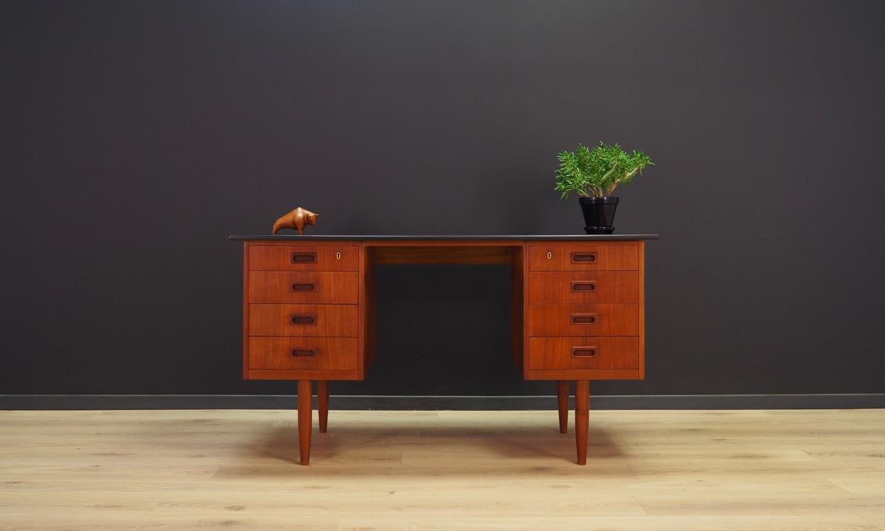 Writing desk from the 1960s-1970s, Minimalist Danish design. Desk veneered with teak, original handles, top painted with black paint. Desk has eight drawers. No key. Preserved in good condition (minor scratches and bruises) - directly for