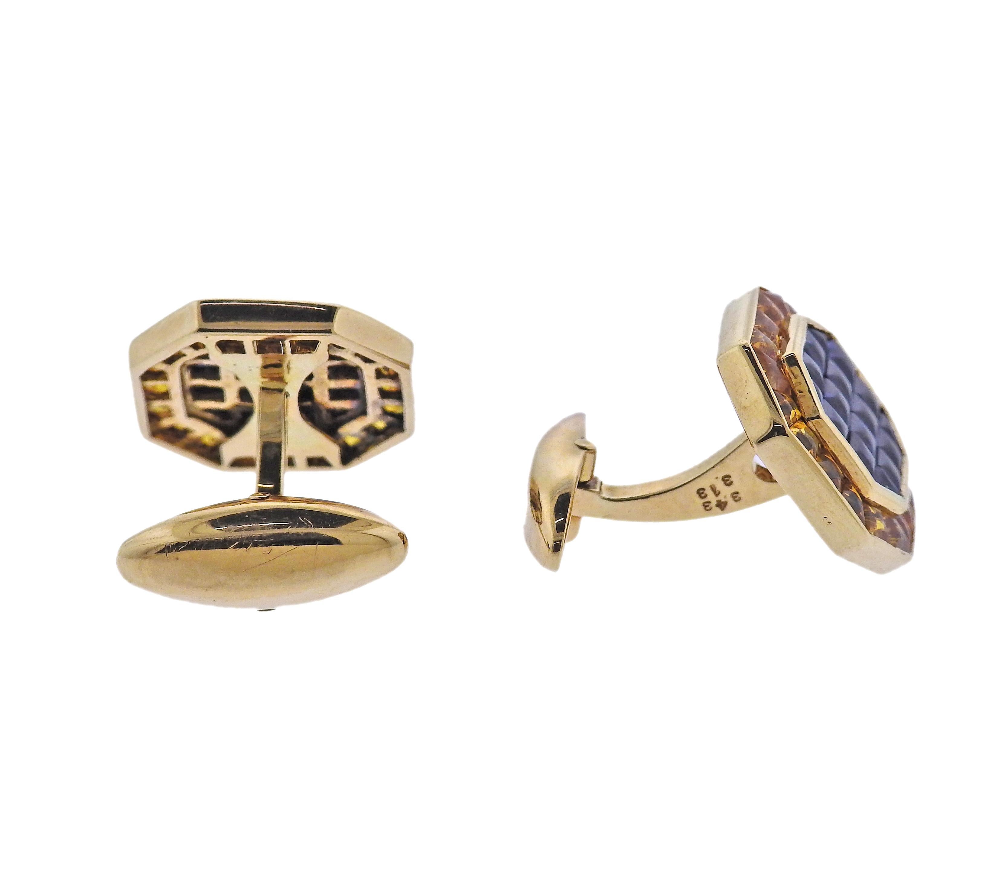 Pair of 18k yellow gold classic octagonal shaped cufflinks set with yellow and blue sapphires. Cufflinks measure 16mm x 16mm. Marked: K18. Weight is 13.7 grams.