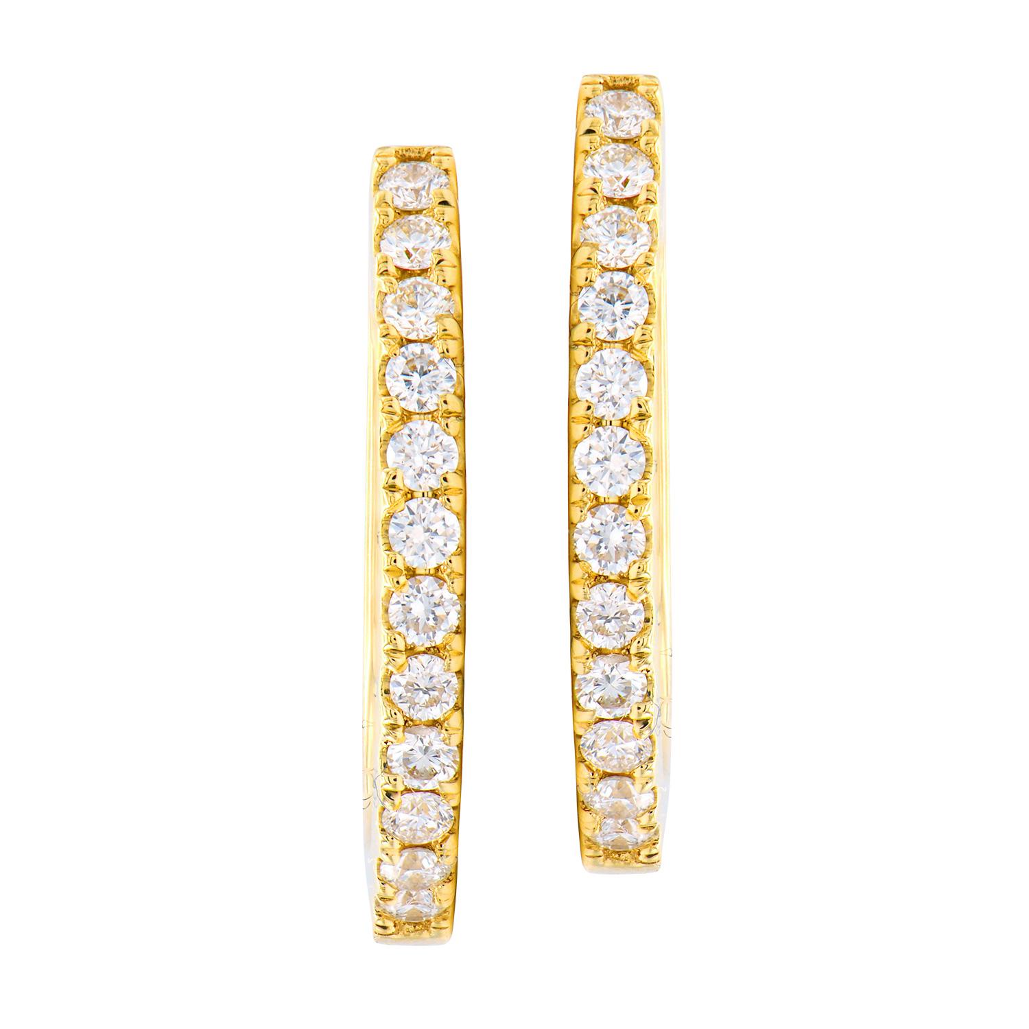 These hoops are the classic and timeless. They are made from 2.9 grams of 18 karat yellow gold with a row of diamonds on the front side. The 24 diamonds are VS2, G color and total 0.27 carats. They are secured through the ear with a post that snaps