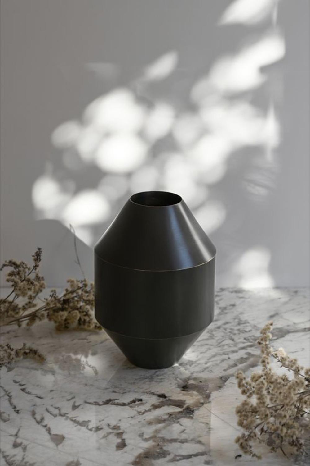Referencing classic ceramic vases and ancient Greek vessels, the Hydro Vase makes a modern statement that incorporates the material properties and appeal of brass. Chosen because it can be shaped in ways that resemble iconic pottery, brass exudes