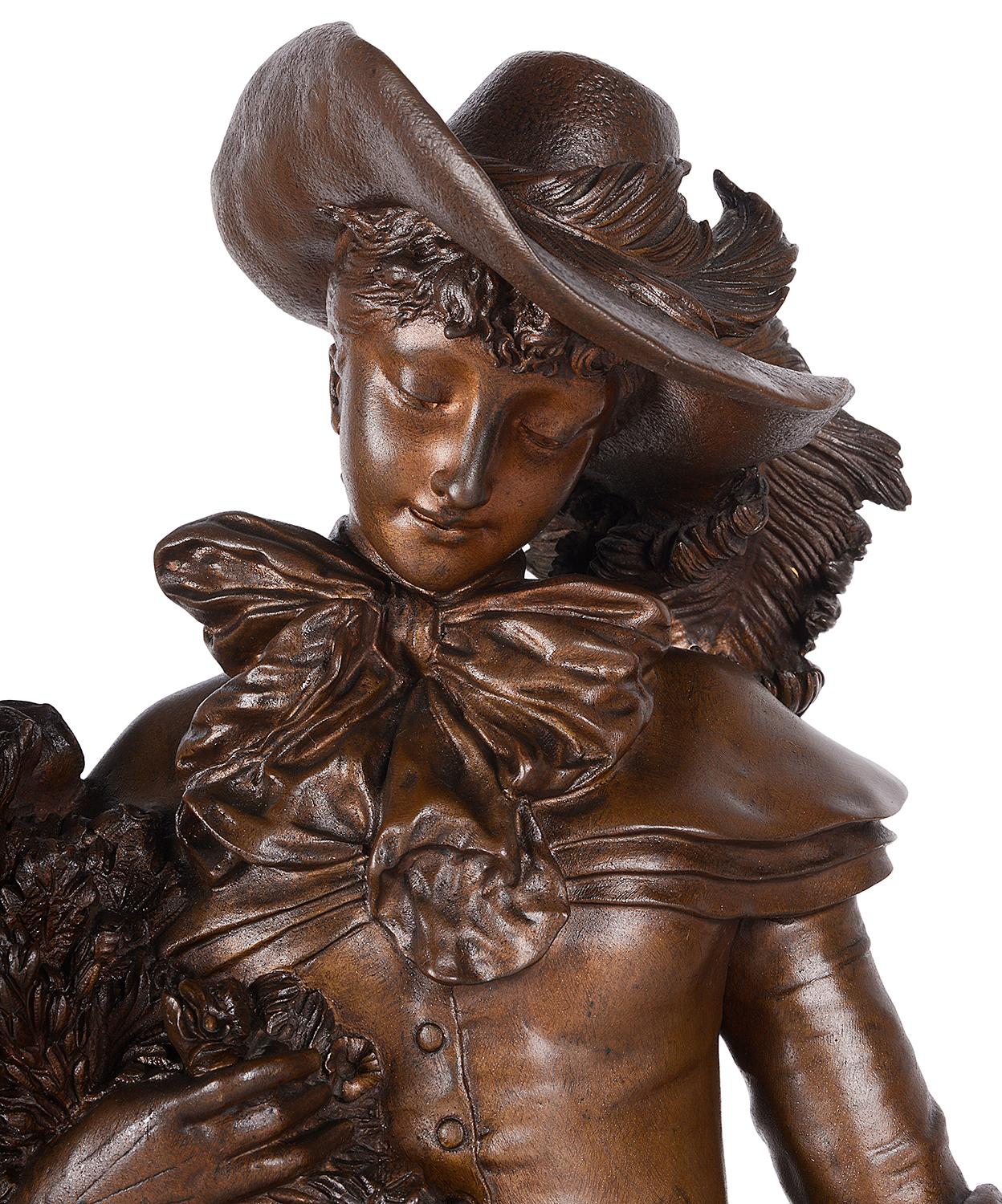 A very good quality 19th century patinated bronze statue of a young lady wearing bonnet, holding a basket of flowers with a Borzoi hound at her side.
Signed; Adrien Étienne Gaudez 

Adrien Étienne Gaudez was a French artist known for his