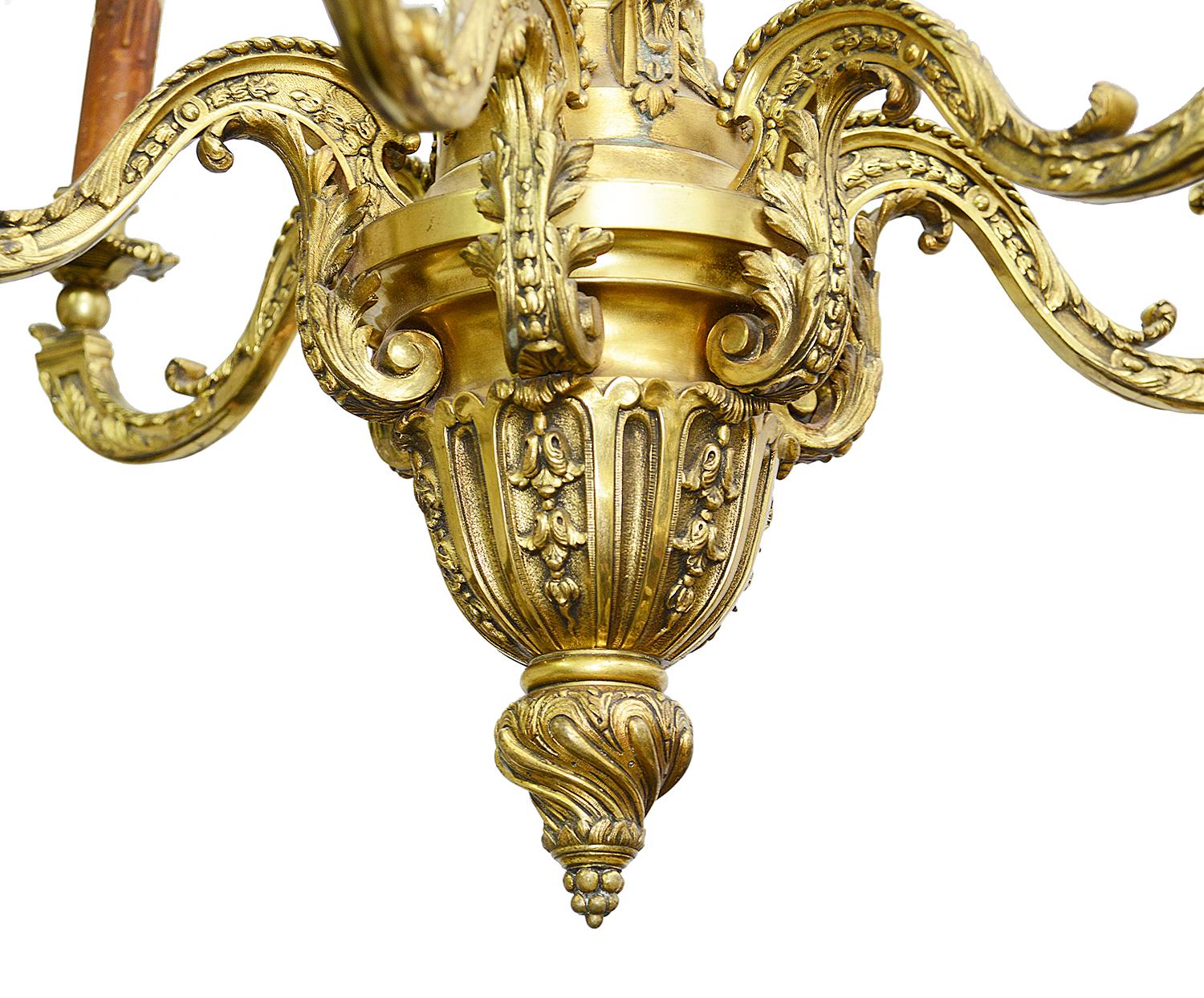 A very good quality 19th century classical French ormolu chandelier, having monopodia supports, six scrolling branch sconces, terminating in an urn and twisted finial.