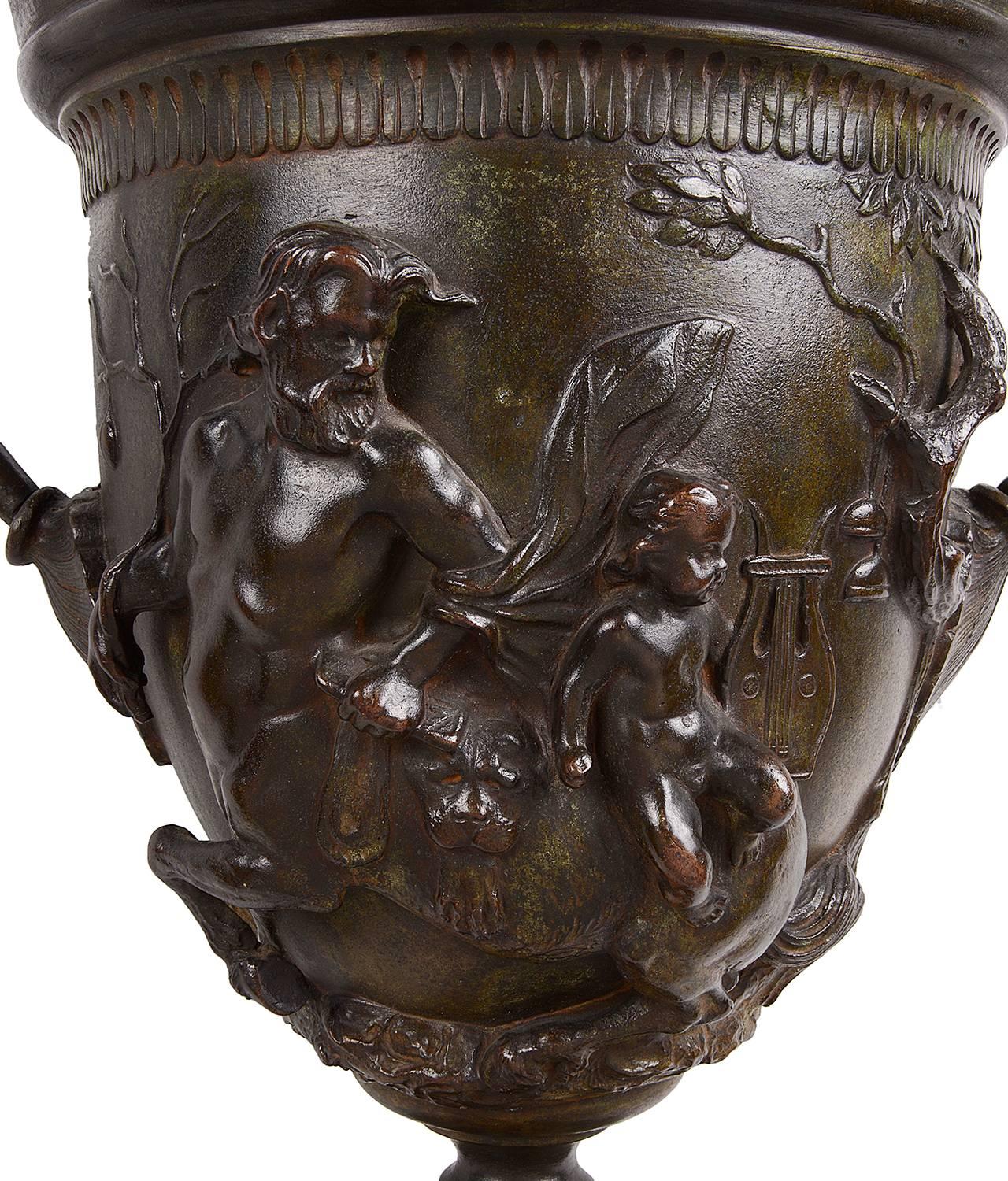 Early 19th century classical two handled bronze urn. Depicting mythical god like figures with cherubs.

This very nice Kantharos with mythology on it, is a 19th century replica of one of the 14 silver Kantharosses found in Pompeii in 1835 during