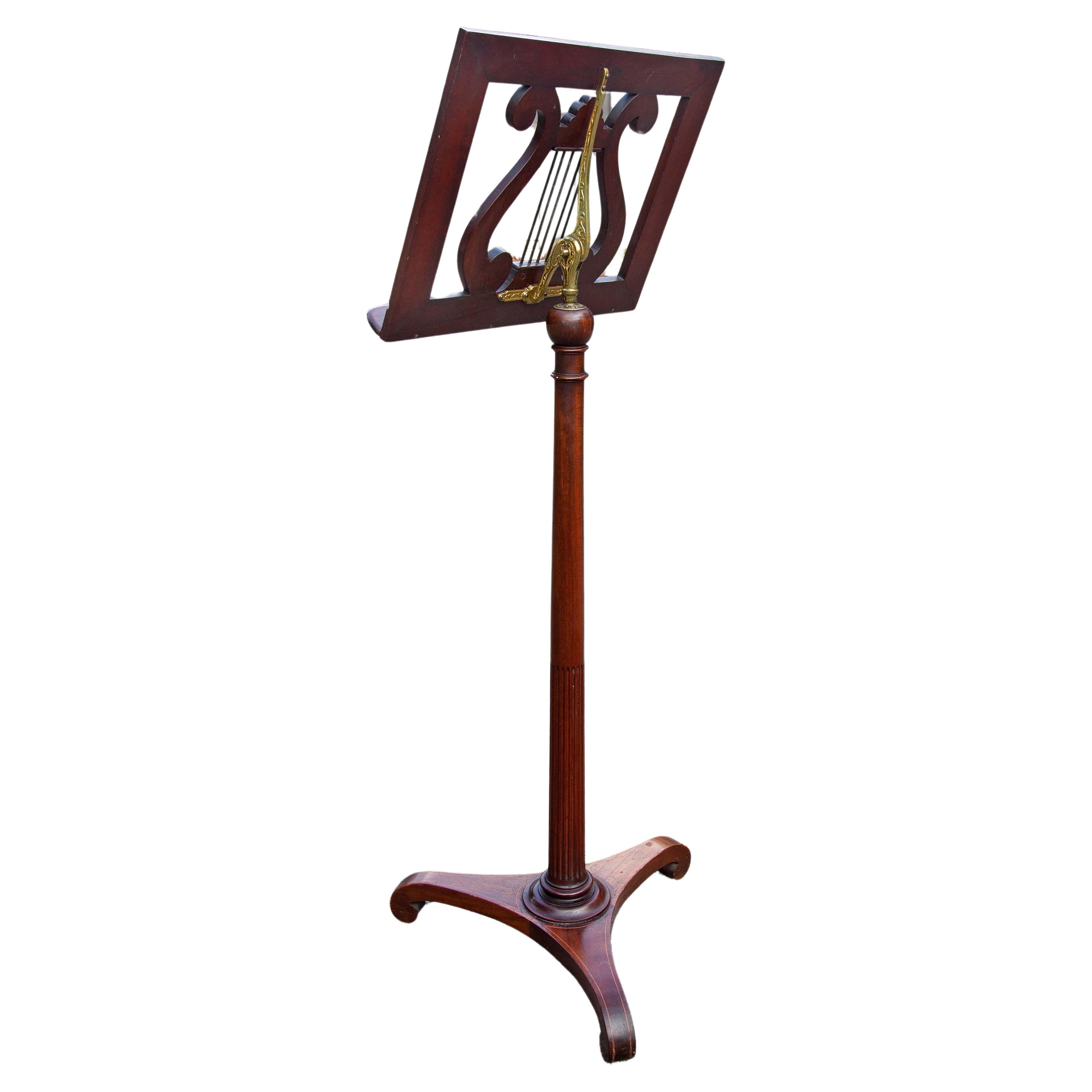 Classical mahogany and brass music stand by Palmer, NY. Adjustable. Circa 1900.
