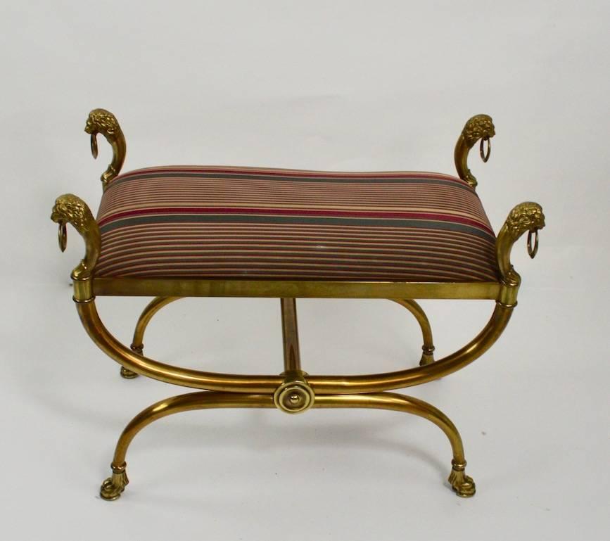 Exquisite brass bench with custom (cotter and kroboth) upholstered pad seat. This bench, or vanity stool, is in excellent clean, and ready to use condition, well crafted with top quality workmanship and materials. Refined classical style, restrained