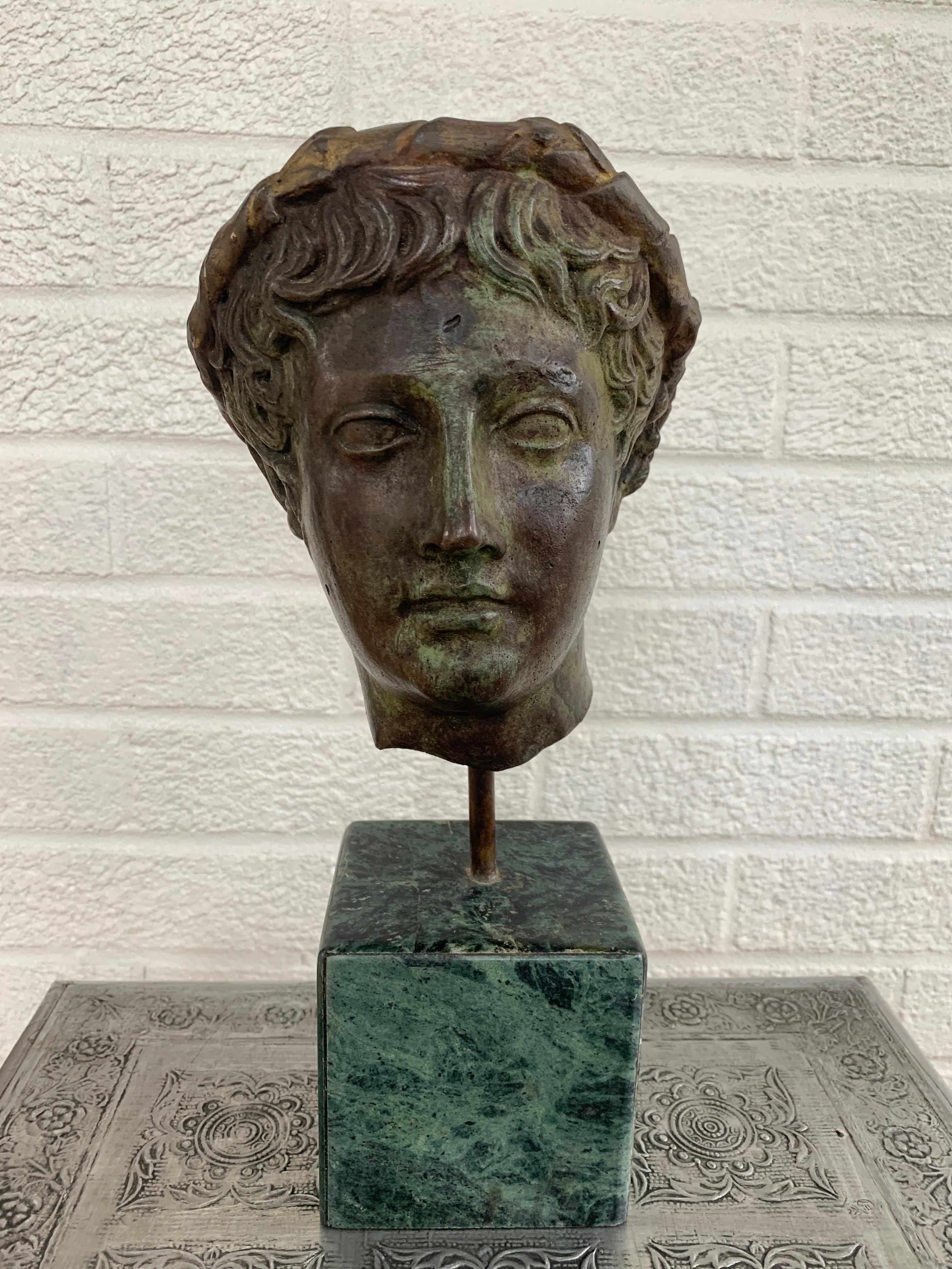 A gorgeous cast brass verdigris Neoclassical Grand Tour style male head bust sculpture on a green marble base

USA, Late 20th Century

Measures: 6