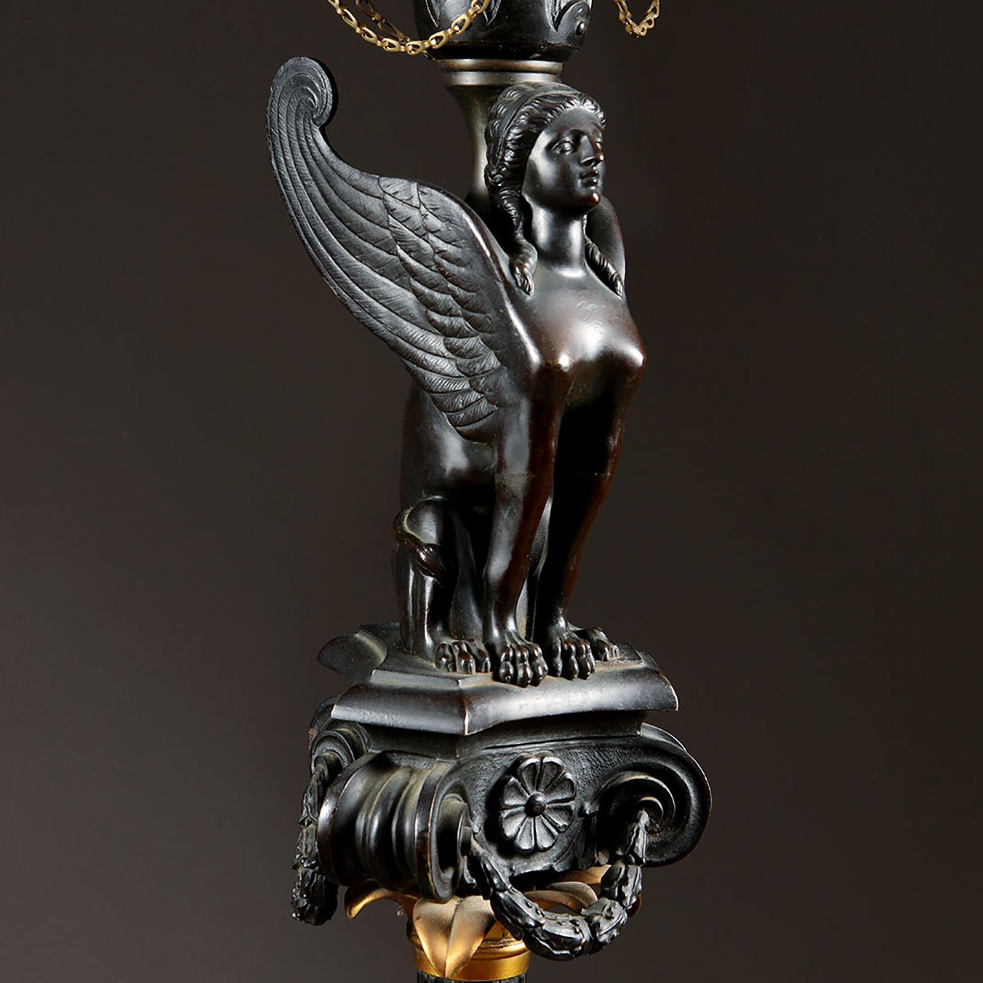 This exceptional cast bronze torchiere is modelled after the Roman originals discovered in Italy
The winged Sphinx is an ancient motif that dates back to Egyptian times, It evolved through the Greeks and Romans through to 'modern'