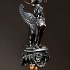 Classical Bronze and Gilt Bronze Torchere with a Winged Sphinx