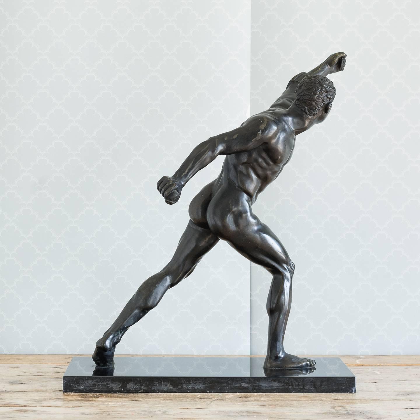 Classical bronze model of the Borghese Gladiator, late 19th century, possibly German, set on a Belgian black marble base.