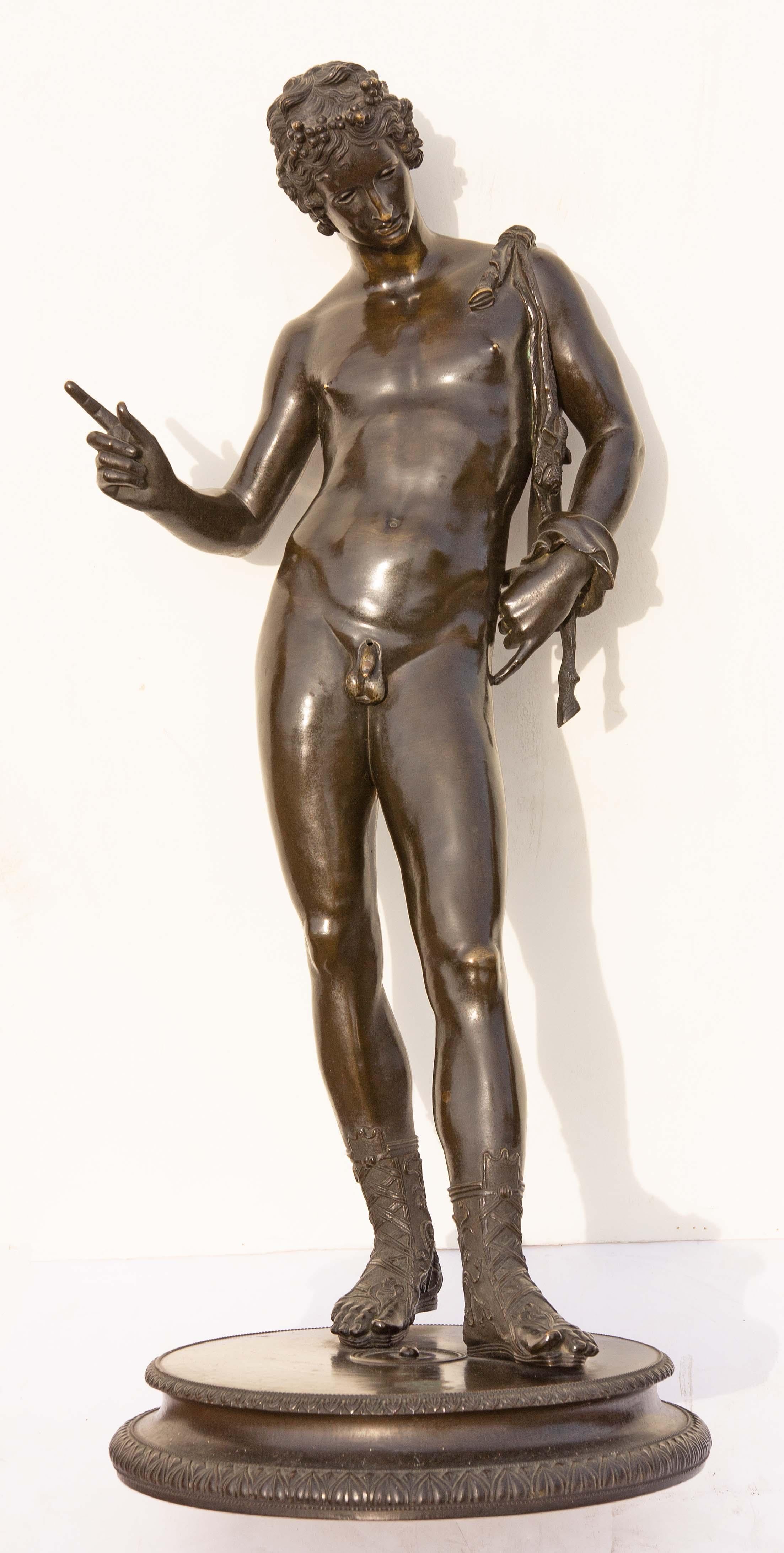 Grand Tour bronze sculpture of Narcissus after the original found in 1862 at Pompeii. When first found in Pompeii it was identified as Narcissus. Years later it was identified as Dionysus. Grand Tour sculpture.