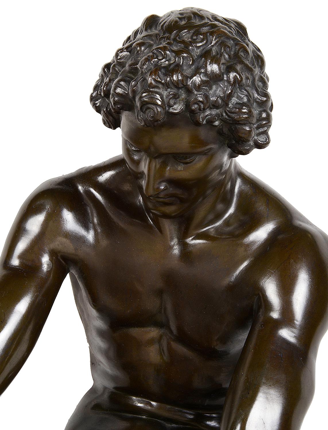 A very good quality 19th century bronze statue of a classical Greek figure breaking wood. Measures: 87cm(34